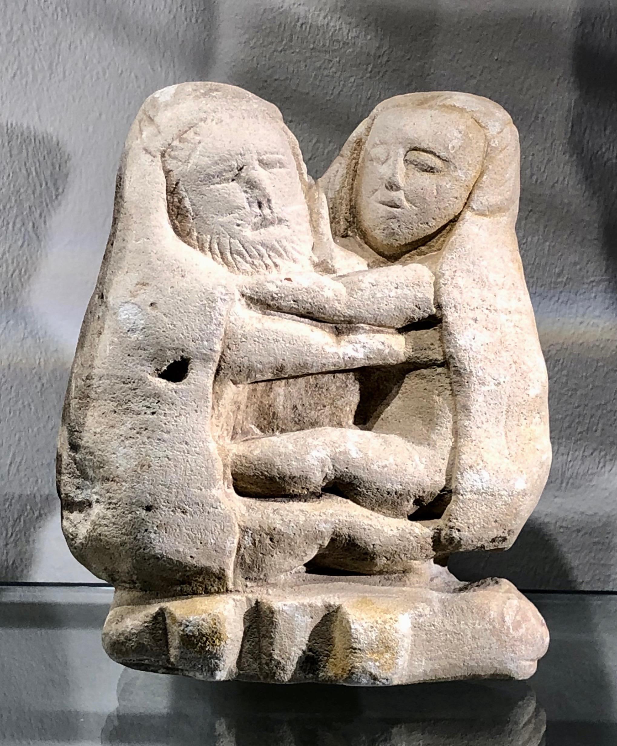 A charming small Greek archaic limestone sculpture of a sitting embracing couple representing the wedding of Zeus and Hera. A votive piece to the temple of Zeus the Meilichios at Selinunt, Sicily, 6th/5th century BC. The reverse is inscribed