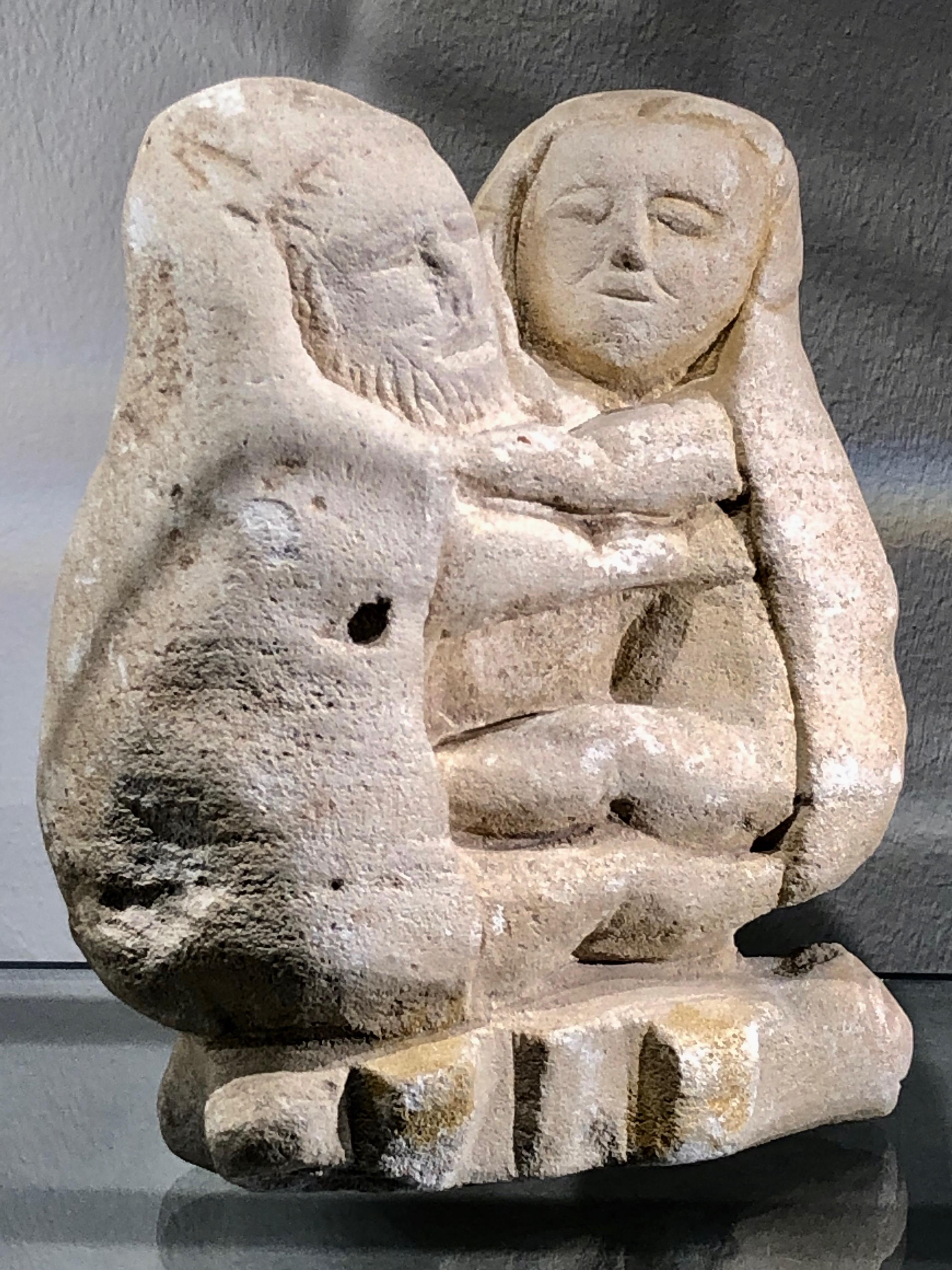 Hand-Carved Greek archaic limestone sculpture representing 
