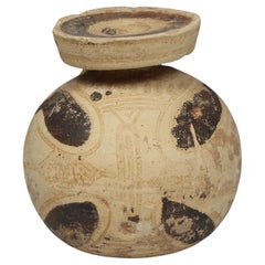 Greek aryballos with quatrefoil motif