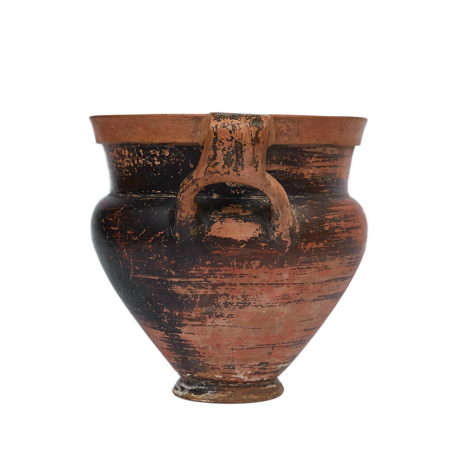Black Glazen column krater,
mid-4th century BC, Apulia.

With broad avoid body on a short echinus foot and thick mouth.
The two handles form loops around the shoulders. 
Resembling the Laconian style this vase is extremely rare due to the integrity