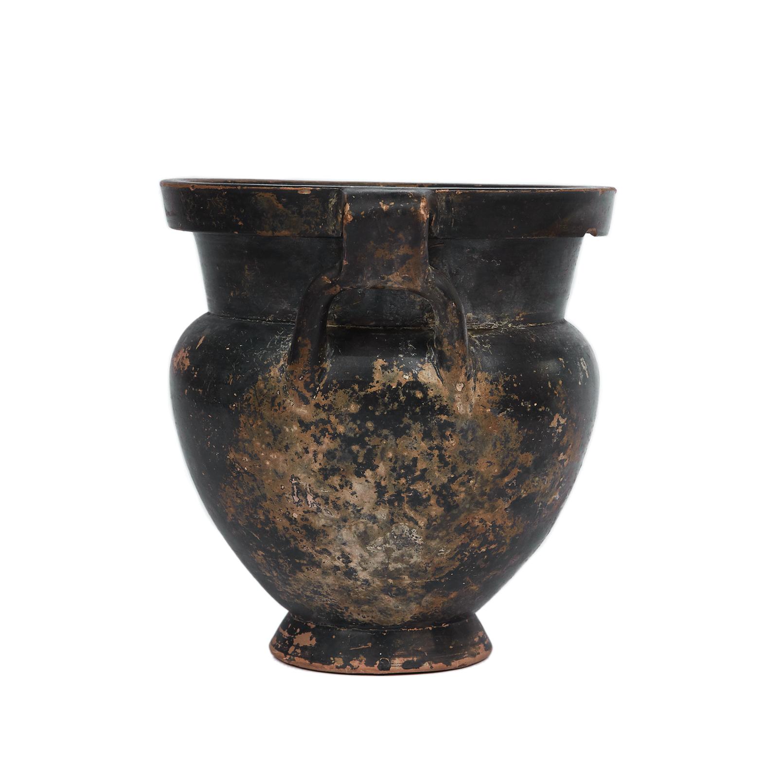 Black Glazen Column Krater
mid-4th century BC, Apulia

With broad avoid body on a short echinus foot and thick mouth.
The two handles form loops around the shoulders. 
Resembling the Laconian style this vase is extremely rare due to the integrity of