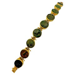Bracelet grec en or jaune avec pièce de bronze 