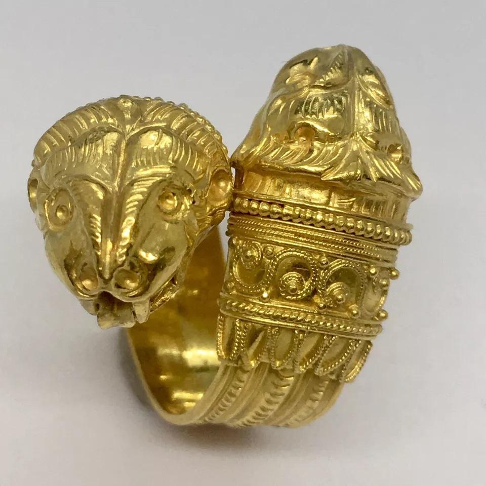 Greek Bypass 22K GOLD Lion Ring 13.9 Gram Size 5.5 Adjustable Wrap Band Hallmark

This exquisite ring is a true piece of history. Made of 22k gold, it features an adjustable design with an engraved hallmark. The ring is perfect for any occasion and