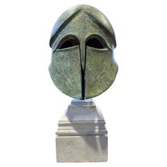 Greek Corinthian Style Bronze Warriors Helmet On a Limestone Base 