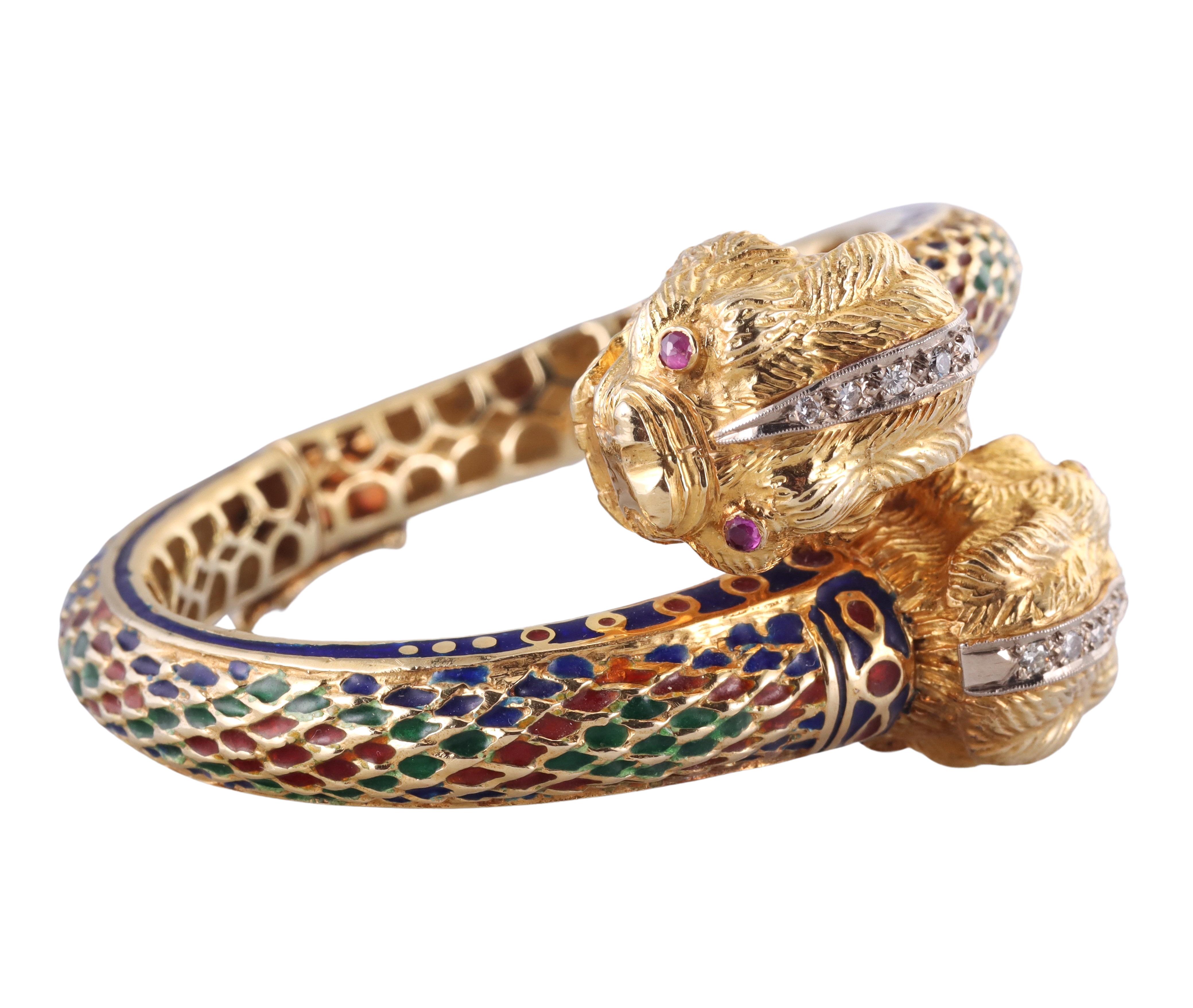 An 18k gold Greek made Chimera bracelet, adorned with enamel, ruby eyes and approximately 0.12ctw H/VS diamonds. Bracelet will fit approximately 6.5