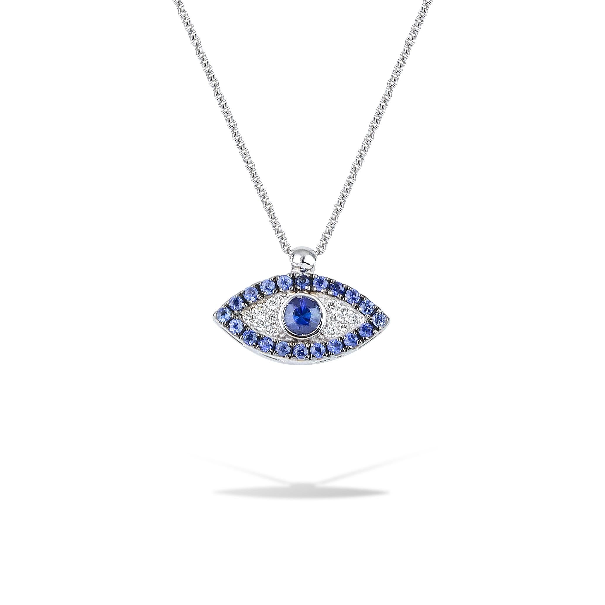 Greek Evil Eye pendant necklace handcrafted in 18Kt gold blue sapphire and diamonds. 
A frame of blue sapphires surrounds the white pave diamonds and they create the shape of an eye. In the greek culture the evil eye protects the one who wears it