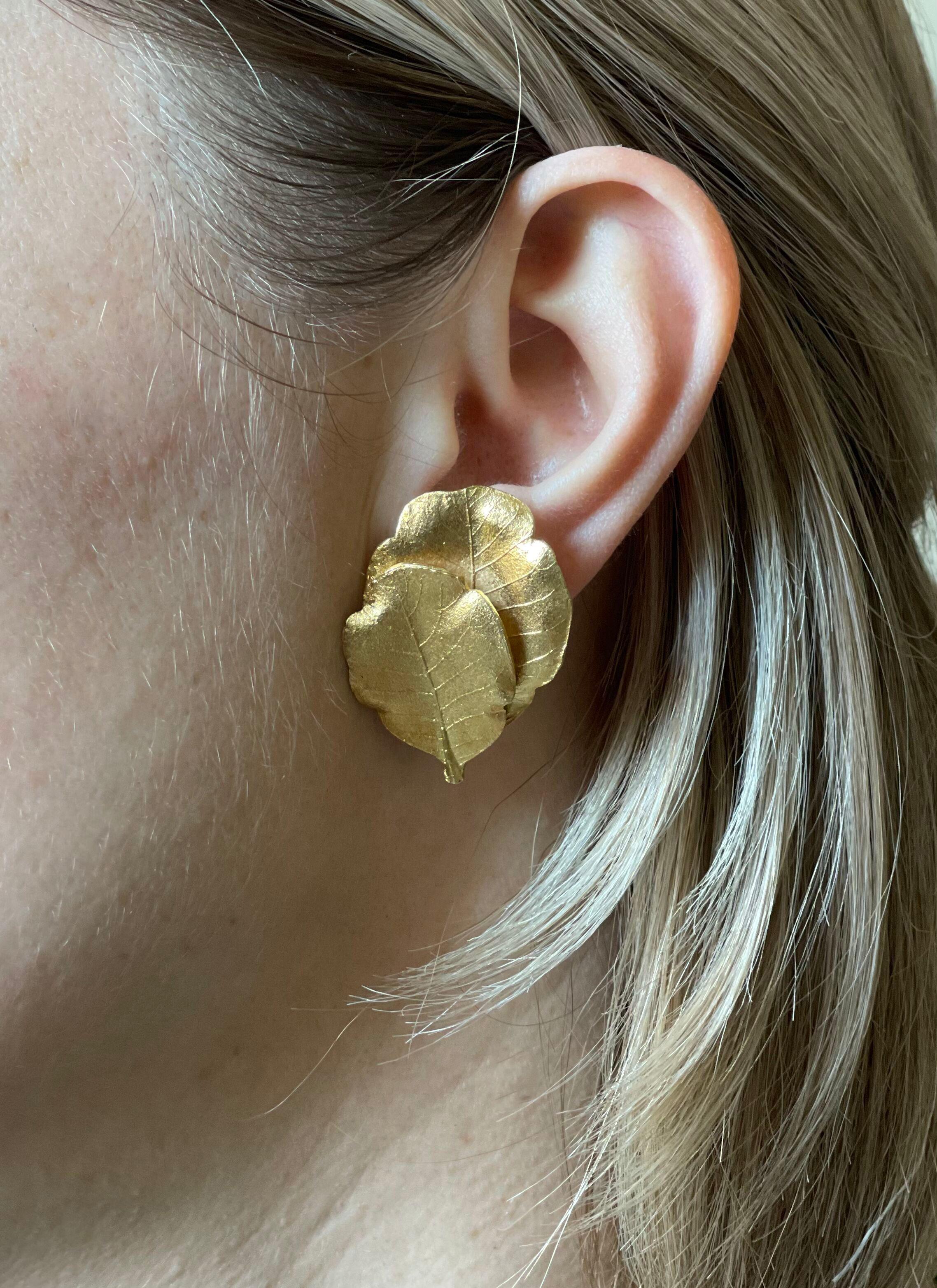 Greek made 18k gold leaf motif earrings, measuring 1.5
