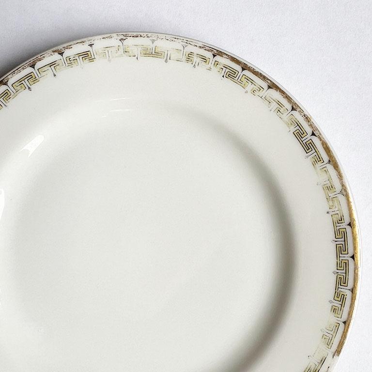 A pair of antique porcelain bread plates by Haviland France. This pair of small plates will be a great addition to any place setting. The edges are decorated in the Arlene Schleiger pattern Albany 107 a. It features a yellow Greek key design around