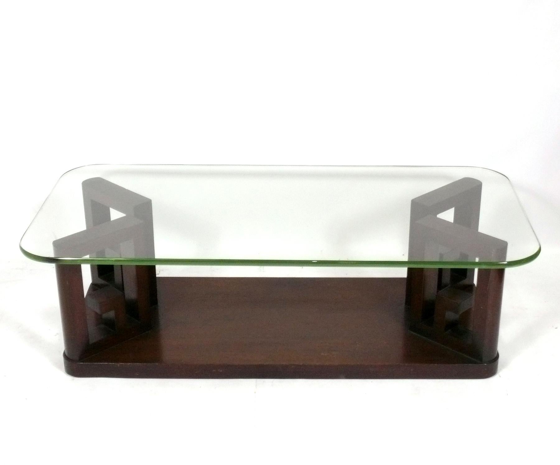 Sculptural Asian Influenced Greek Key Design Coffee Table, attributed to Paul Frankl, unsigned, American, circa 1940s. Retains it's original thick glass top in that beautiful Coke bottle green glass that they stopped making in the 1940s. This table