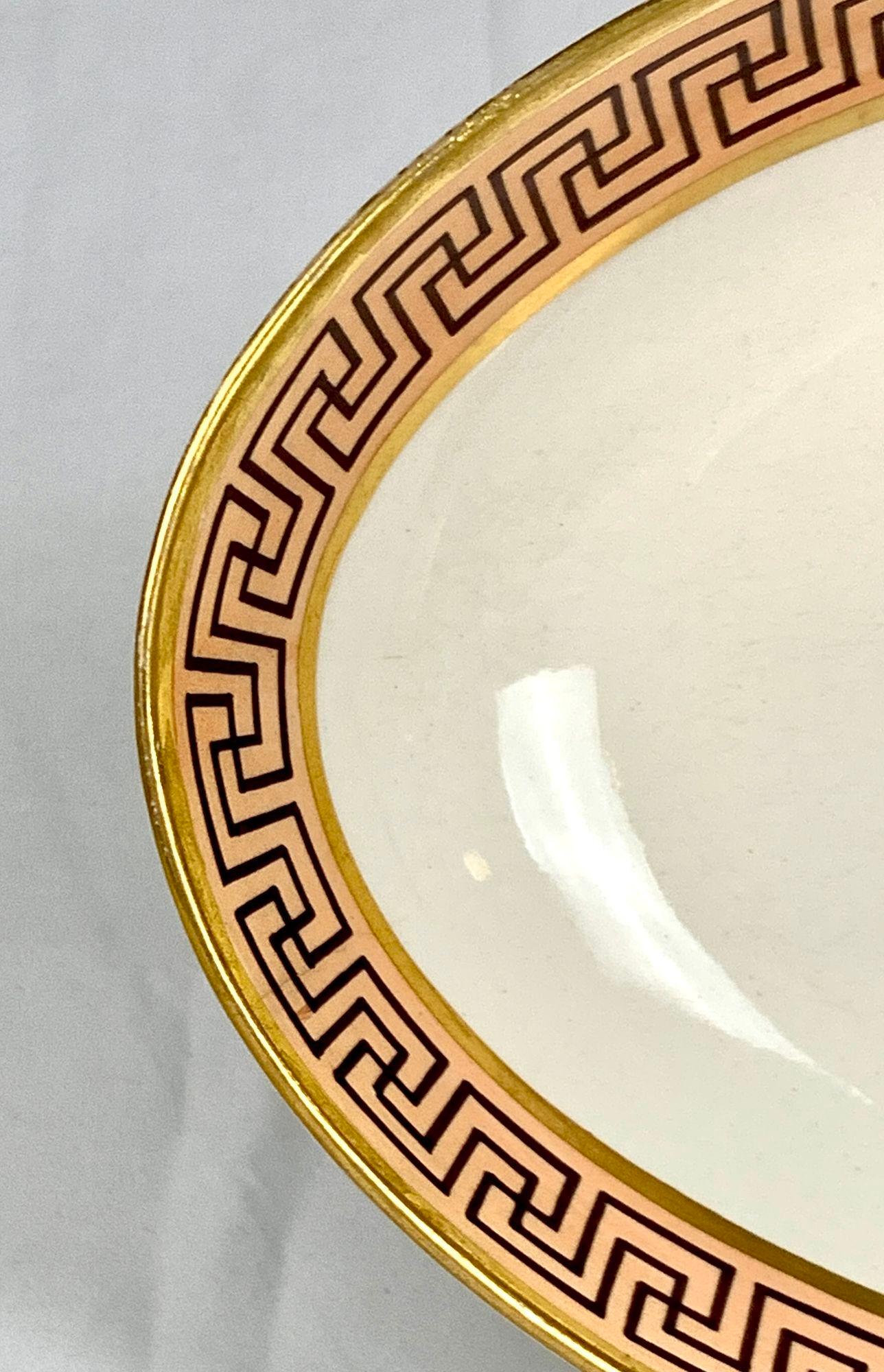 This is the perfect dish to place on a low table with candies or by the front door to welcome you home and hold your keys and other small items.
The strong purple Greek key decoration on the soft peach ground is exquisite!
The lavish gilding framing
