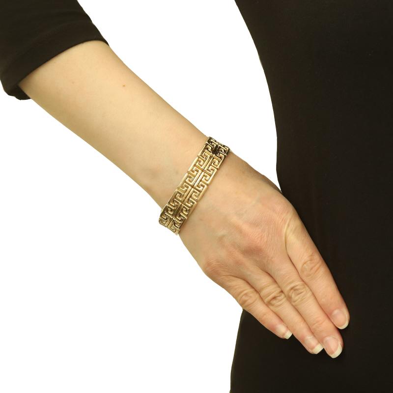Metal Content: 14k Yellow Gold

Style: Link
Fastening Type: Tab Box Clasp with Two Side Safety Clasps
Theme: Greek Key
Features: Smooth & Textured Finishes

Measurements

Length: 7
