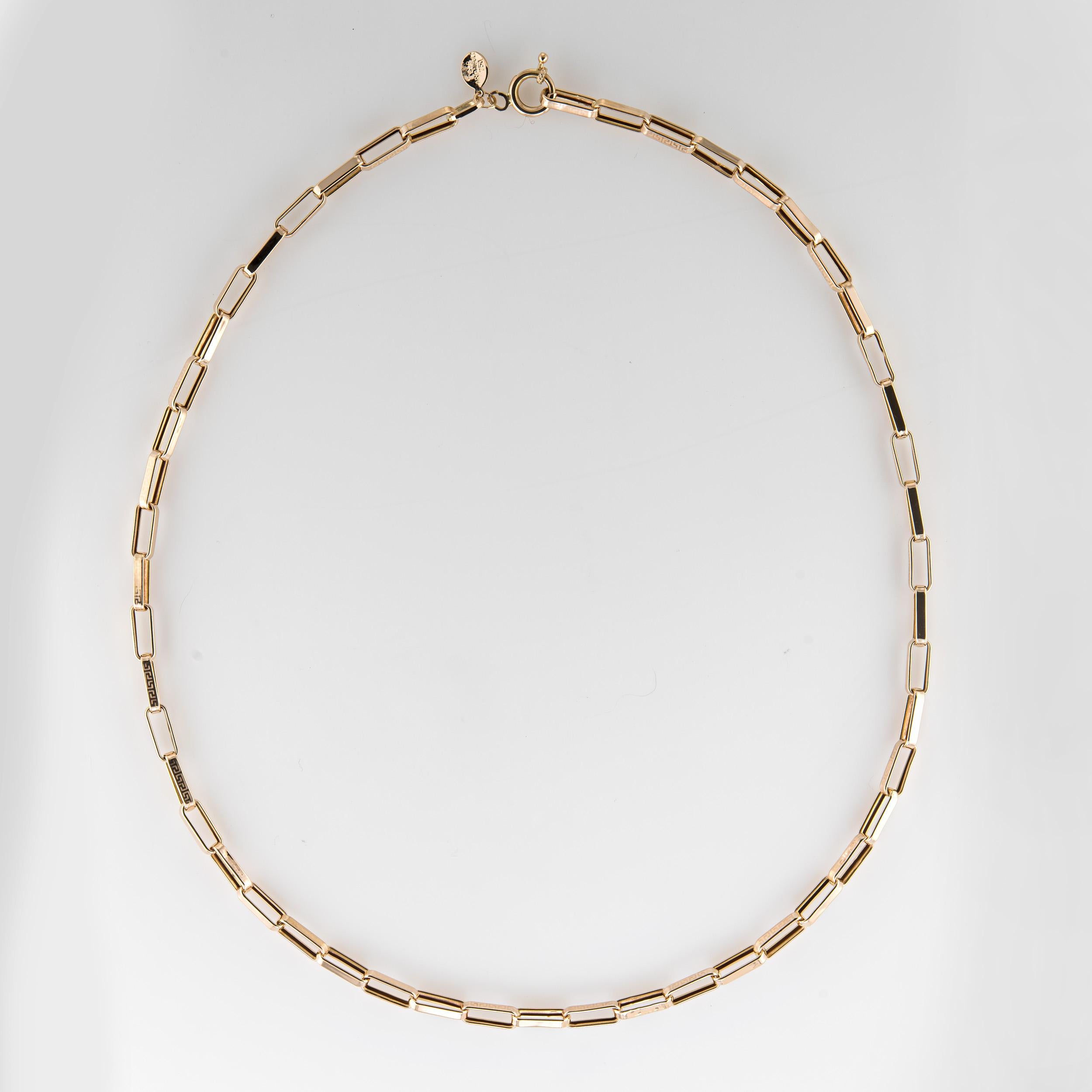 Stylish and finely detailed estate necklace crafted in 18 karat yellow gold.  

The necklace features rectangular links with an alternating etched Greek key pattern to every other link. The 20 inch necklace is great worn alone or layered with your