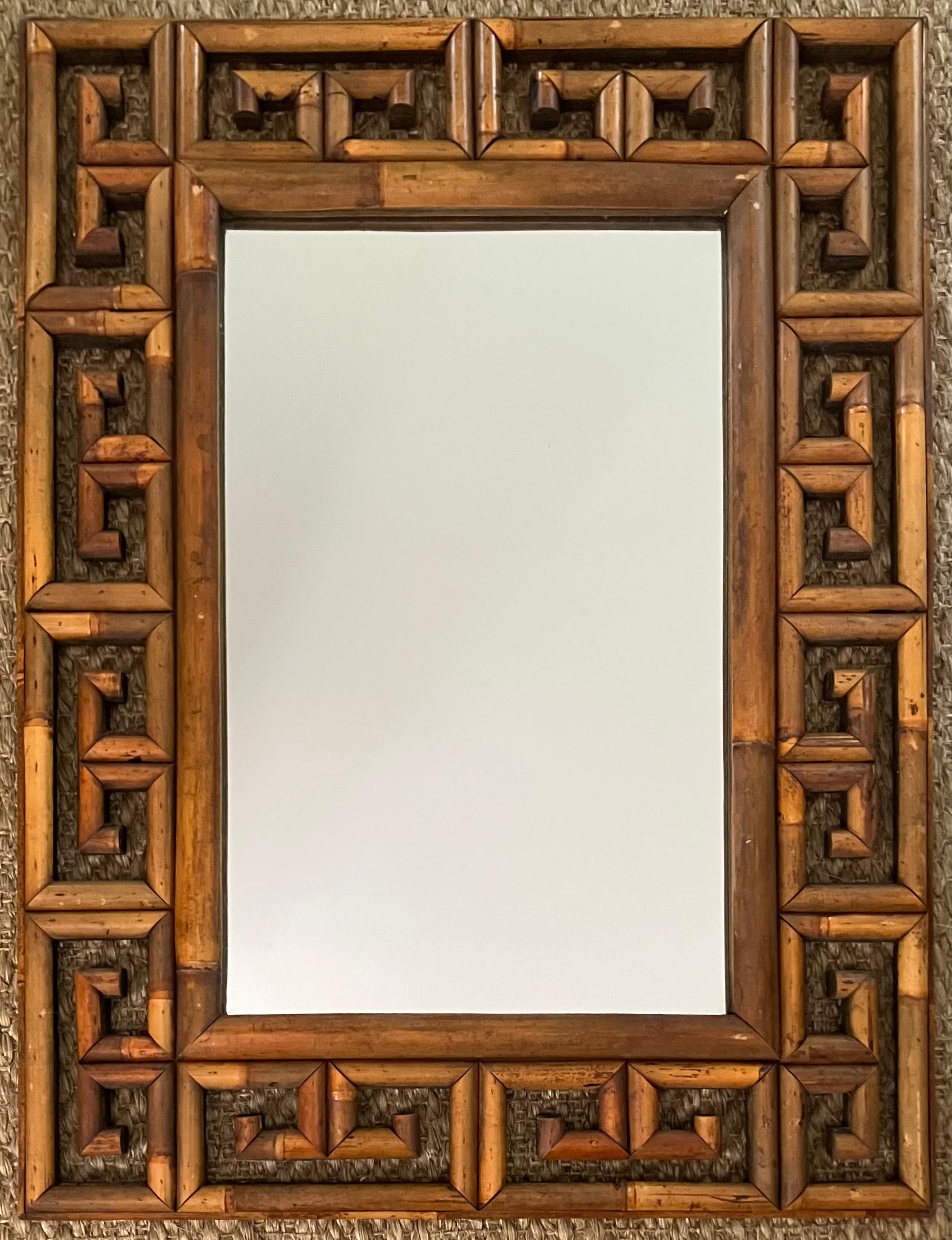 Greek Key Rattan Mirror. Vintage rattan framed mirror in Greek key style. Italy, Mid-20th century
Dimensions: 31.75