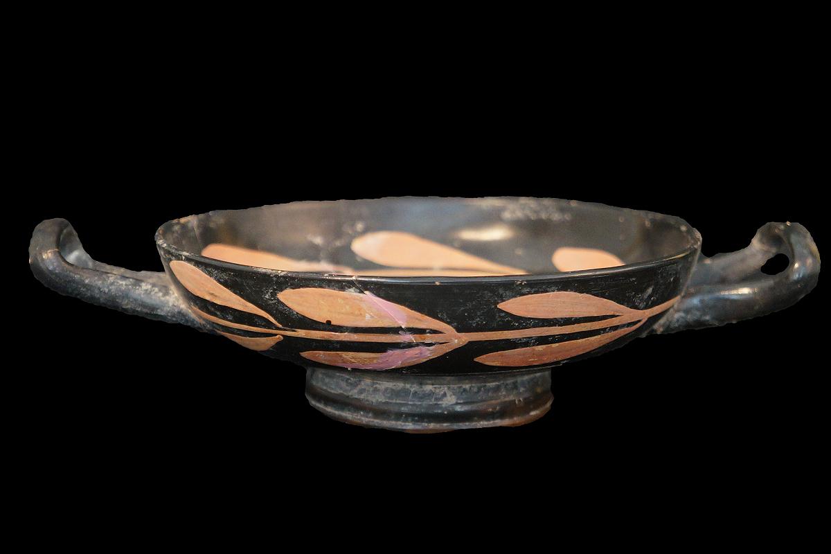 The kylix comes with an international Certificate of Authenticity.

This very elegantly shaped Ancient Greek pottery is called ‘kylix’ and is the most common type of wine-drinking cups. The primary use for the kylix was drinking at a symposium or