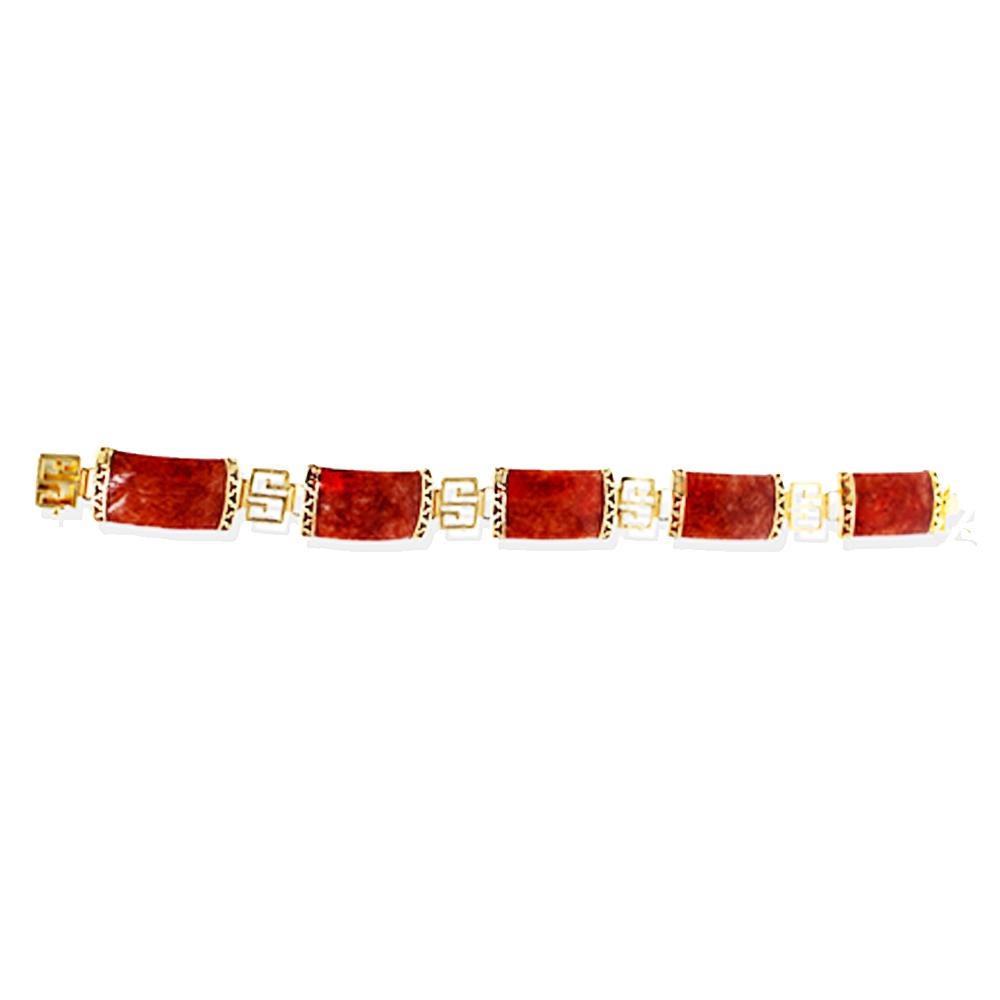 Orange Jade, Infinity Greek Key 14 karat Gold Bracelet.  Jade convex links are accented with gold, Greek key symbols. Links are the most important symbol in Ancient Greece, symbolizing infinity or the eternal flow of things.
Measures 7.5 inches in