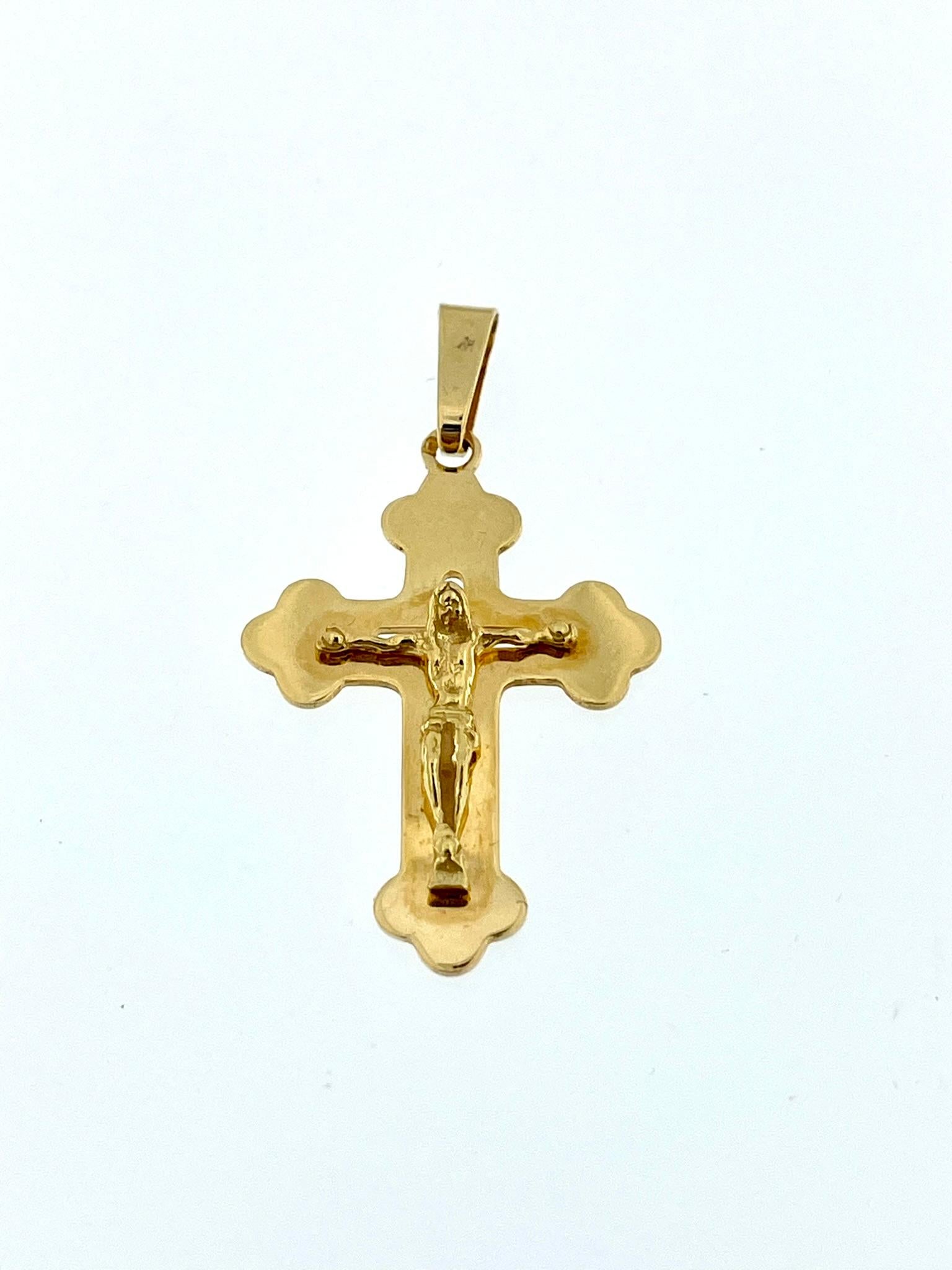 The Greek Orthodox 18kt Yellow Gold Crucifix is a religious cross made from 18-karat yellow gold. It is specifically designed following the style and traditions of the Greek Orthodox Church. The pendant features open work and relief work, which