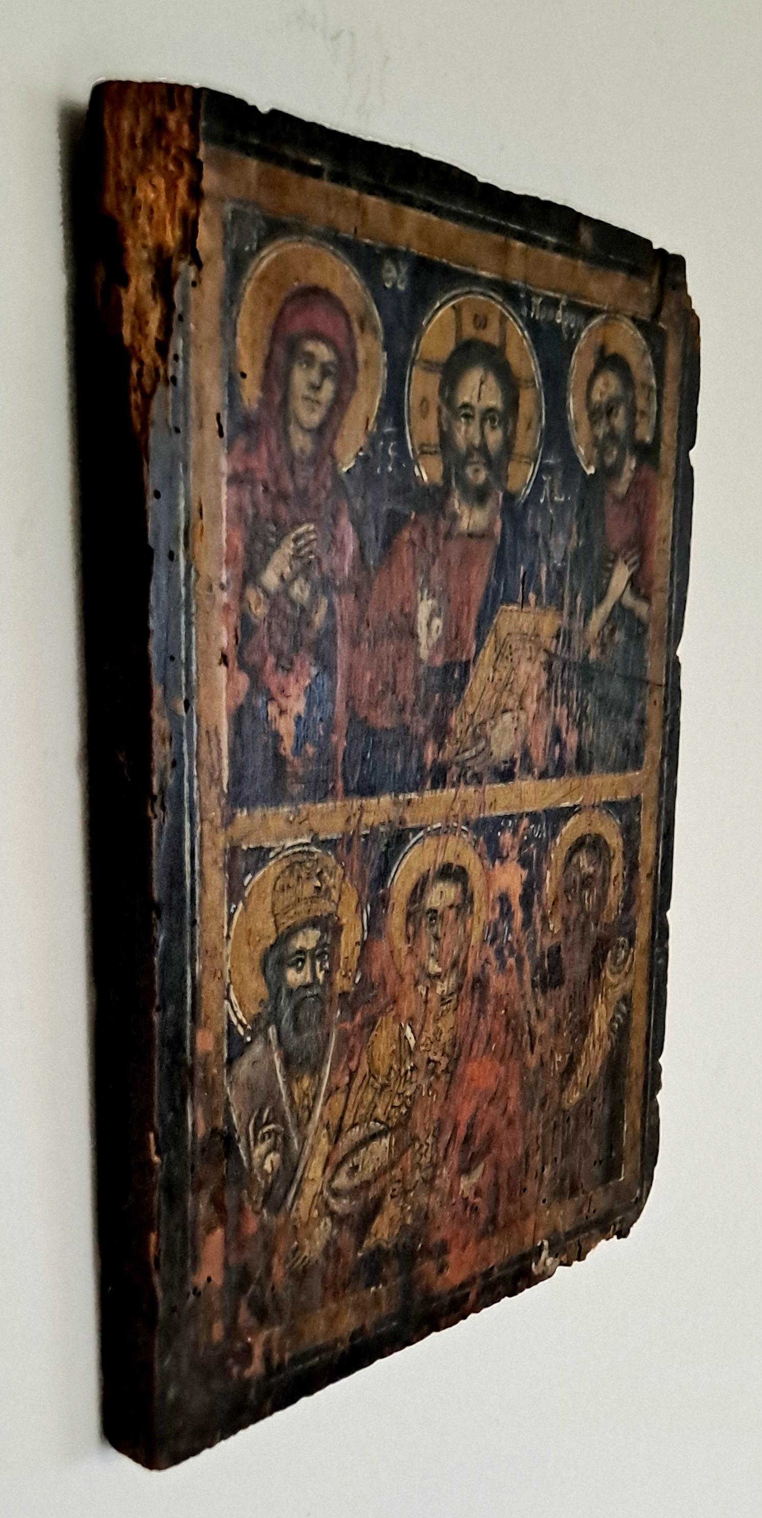  Greek Orthodox icon painted over gold leaf laid on a wooden board. Byzantine style and painted with egg tempera .
