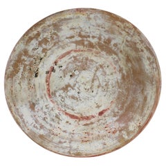 Antique Greek plate with remains of painted decoration