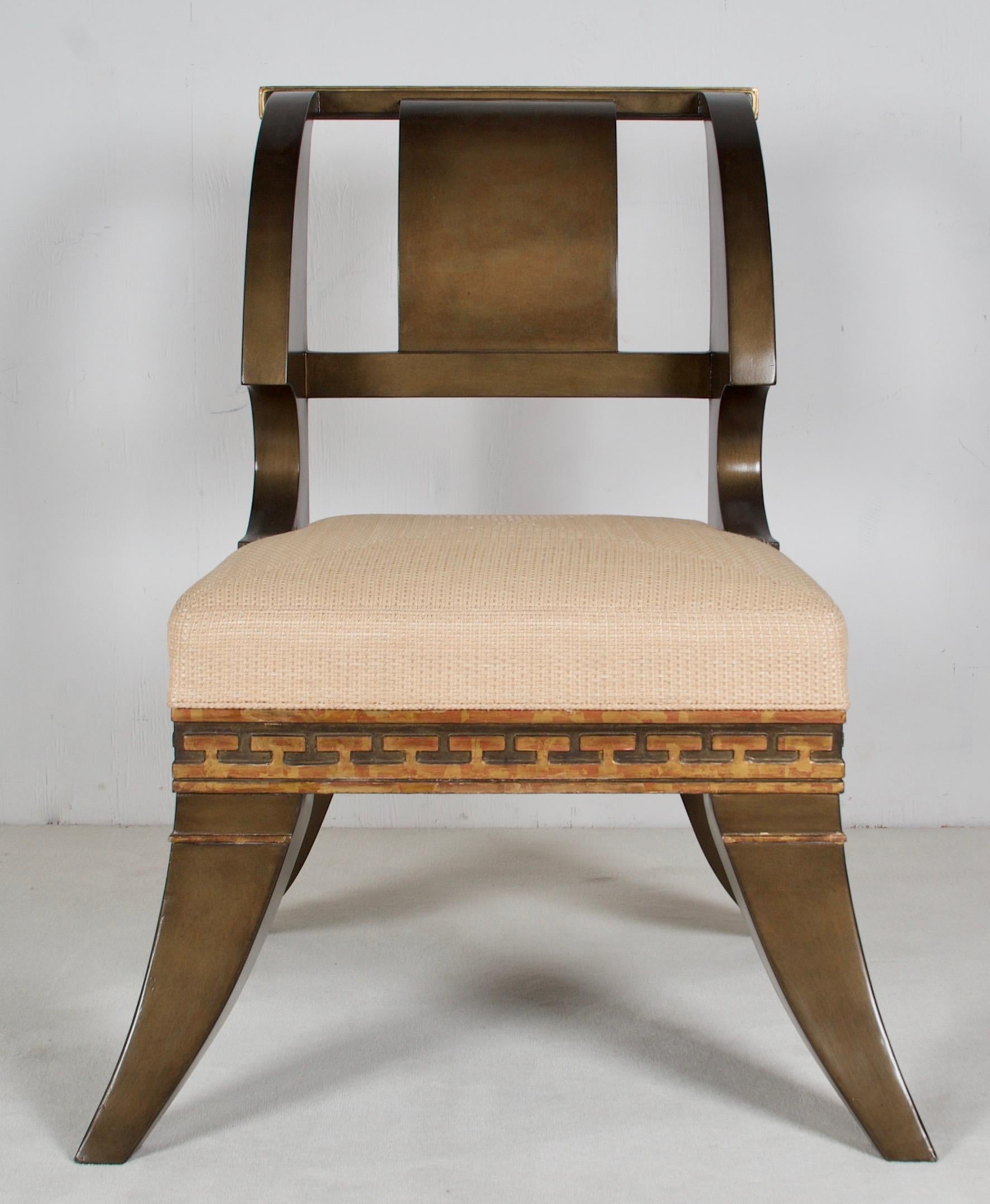 These chairs are after a model and drawings by Thomas Hope, the famous neoclassic designer of the late 18th and early 19th century England. One of his chairs you can find
at the V&A website, another model is homed at the Chicago Art Museum. Both