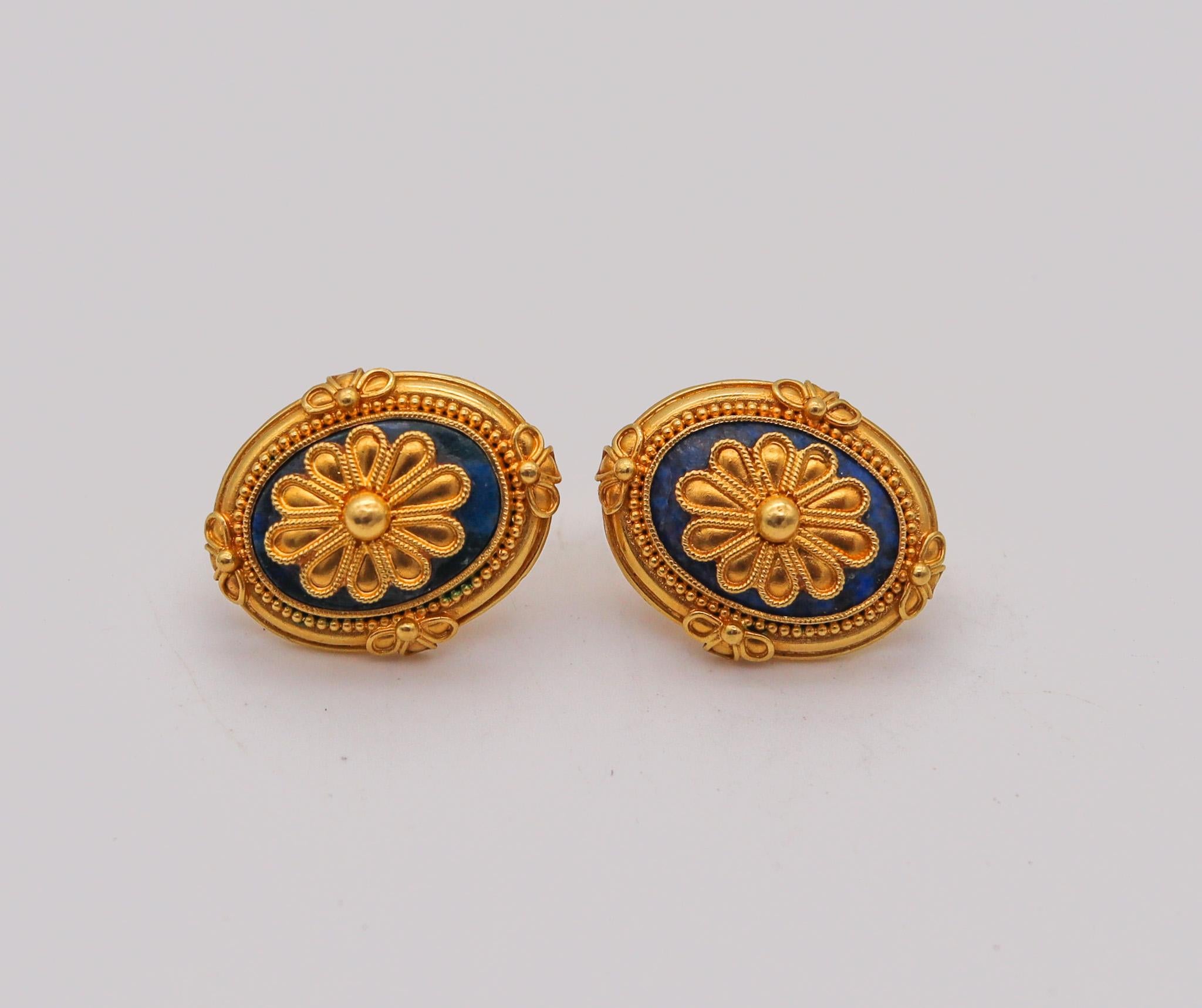 Greek revival earrings with lapis lazuli.

Beautiful pair of Hellenistic earrings, made in Greece in the style of the ancient Greeks with floreated designs. This pair has been crafted with oval shapes in solid yellow gold of 22 karats with highly