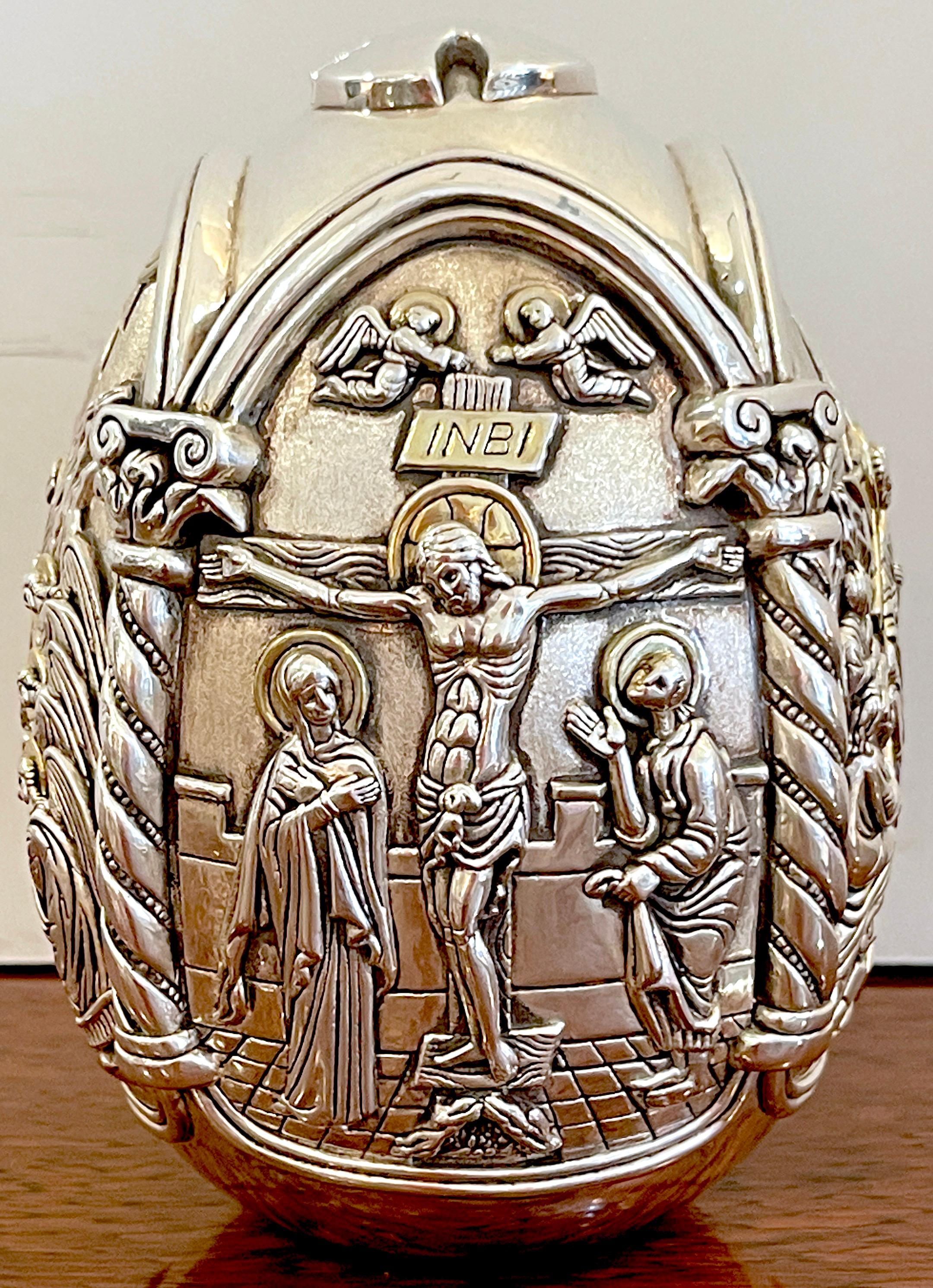 Greek sterling tetralogy icon egg sculpture of Christ's Life
Greece, Circa 1970s 
This intricate and highly detailed work consists of four depictions of events in Christs life. Specifically the sculpture displays The nativity, The crucifixion, The