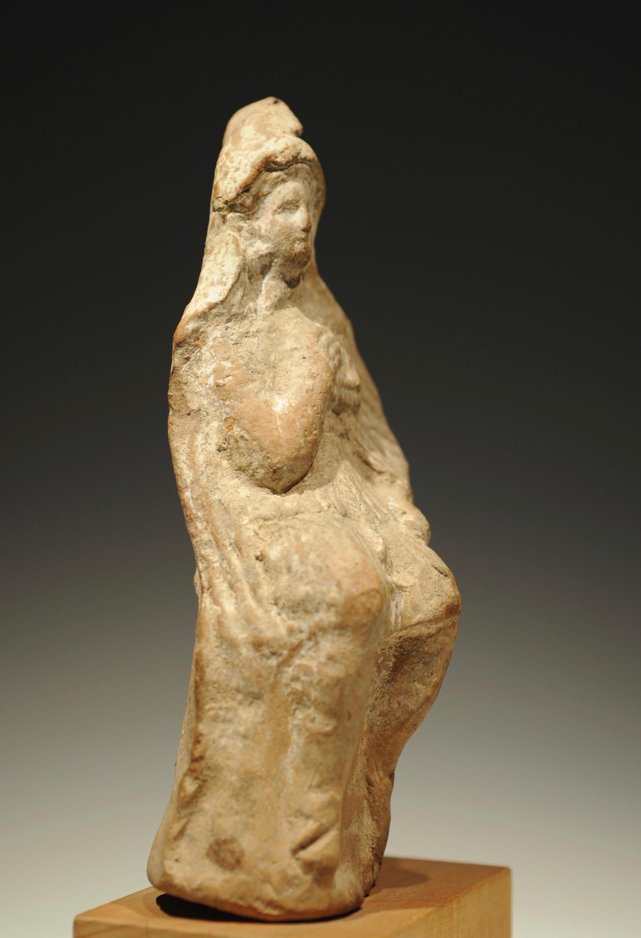 Terracotta statuette of a sitting shepherd god with syrinx. Greek, Amphipolis, circa 400 BC. Intact, no restorations.
Syrinx is a musical instruments also known as Pan flute. It is a musical instrument consisting of multiple pipes and is an