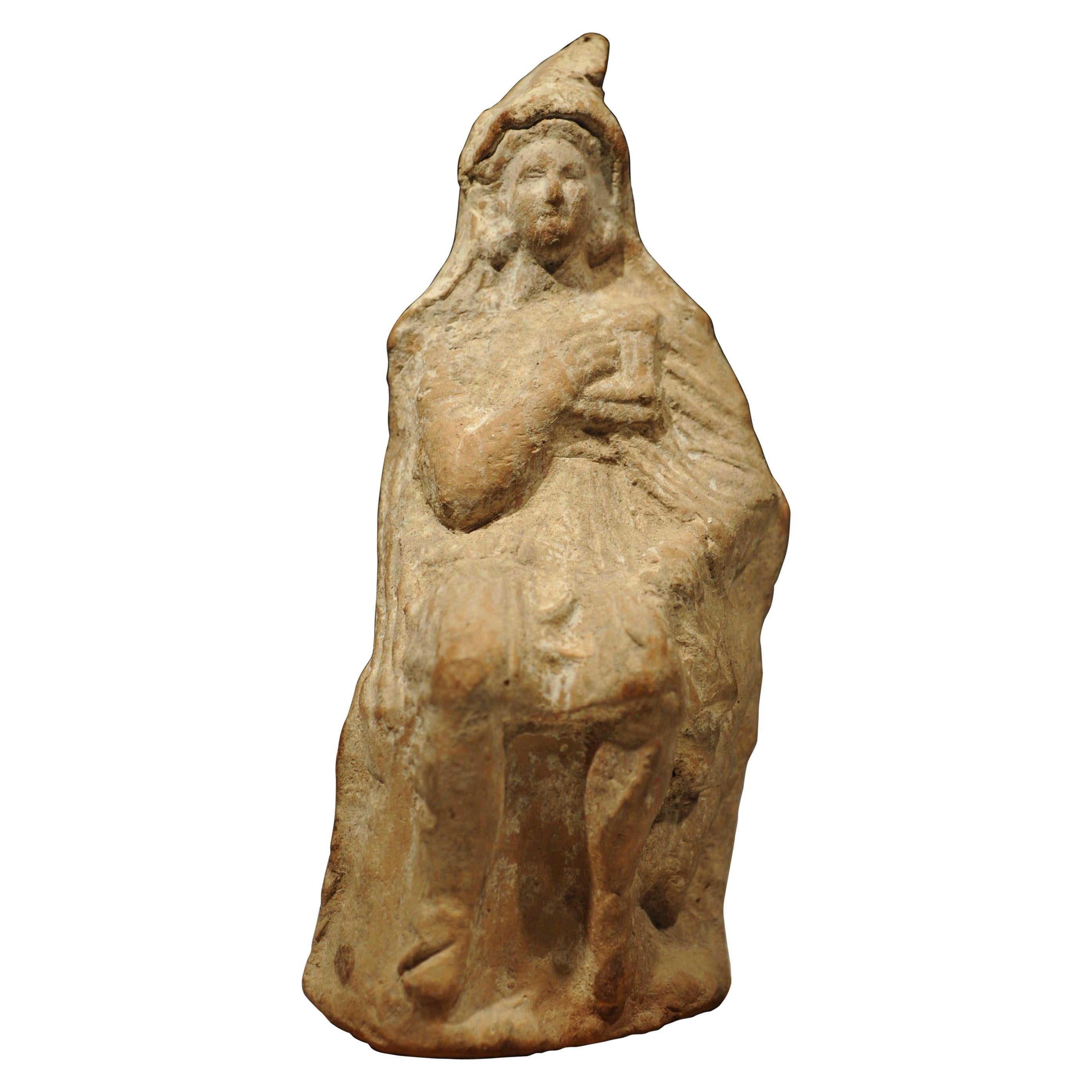 Greek Terracotta Statuette of a Shepherd God Playing the Syrinx For Sale