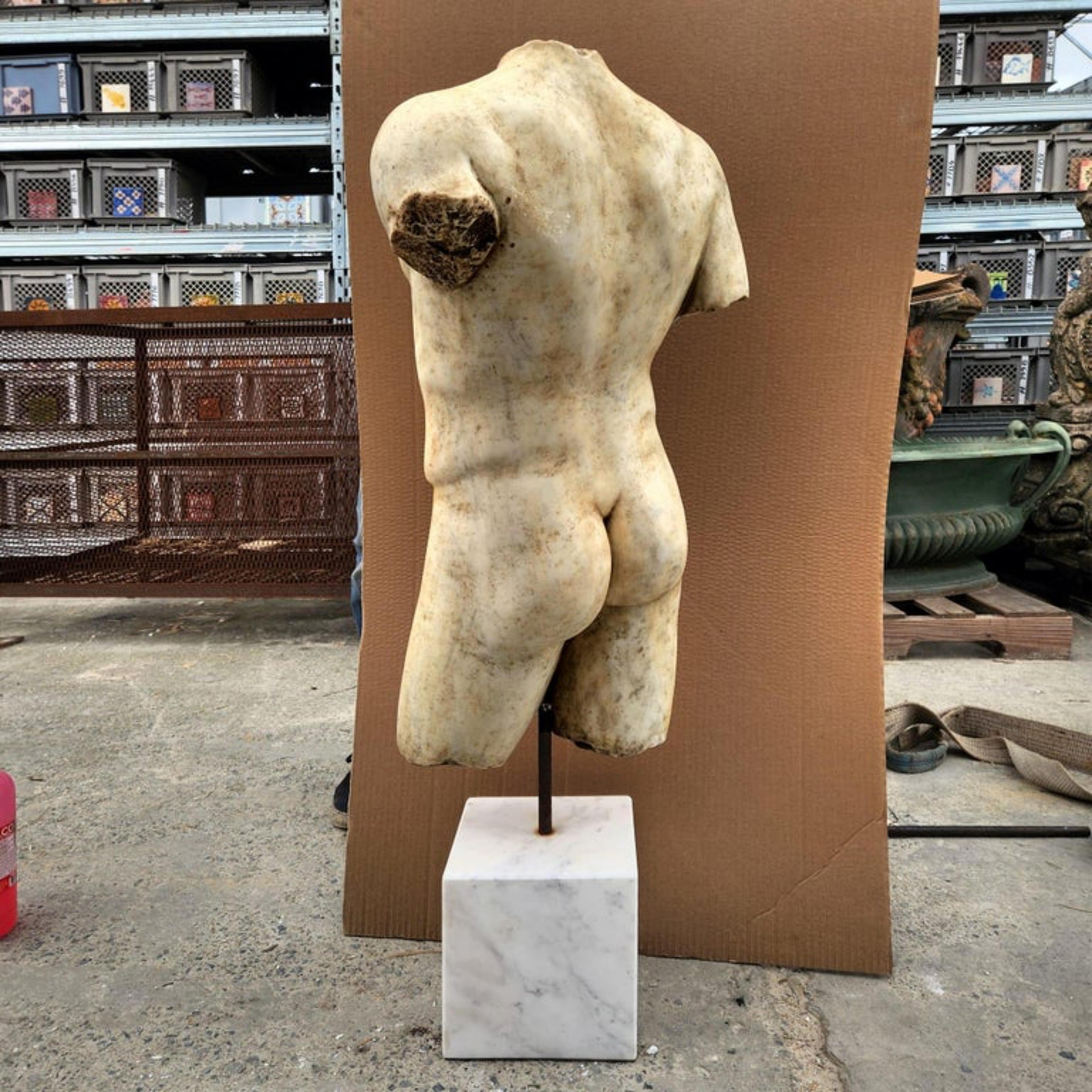 Greek Torso - white Carrara marble 19th century

Copy of a Greek torso, made of white Cararra marble.
The stone base is included, the iron is fixed to the base and the statue instead remains floating so that it can be turned at will.

Measures: