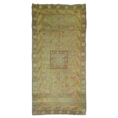Tapis Khotan en laine ancienne verte du 19ème siècle