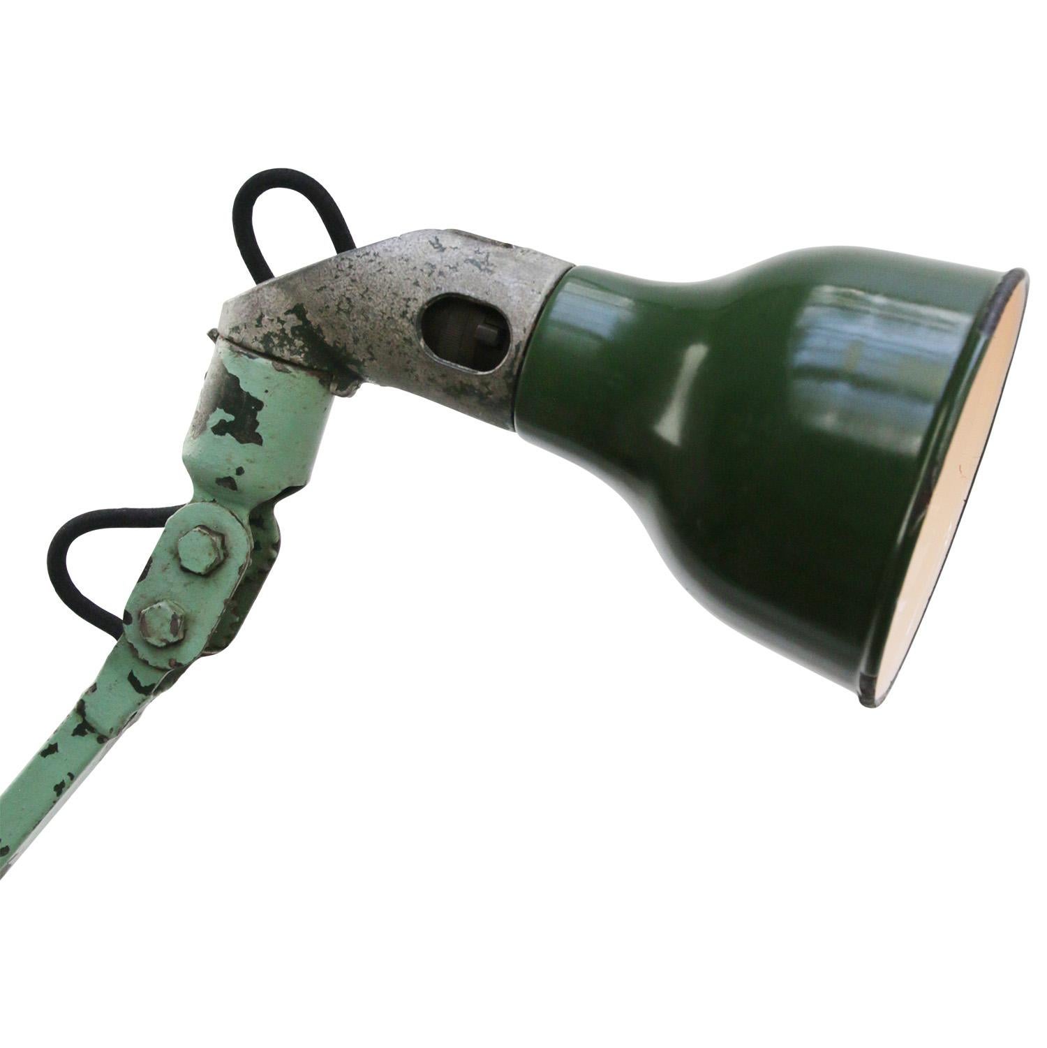 1930s Green enamel, cast iron industrial 2 arm machinist work light by MEK ELEK, UK
Adjustable in height and angle
Including plug and switch

Base size 7 × 7 cm

Weight: 2.40 kg / 5.3 lb

Priced per individual item. All lamps have been made