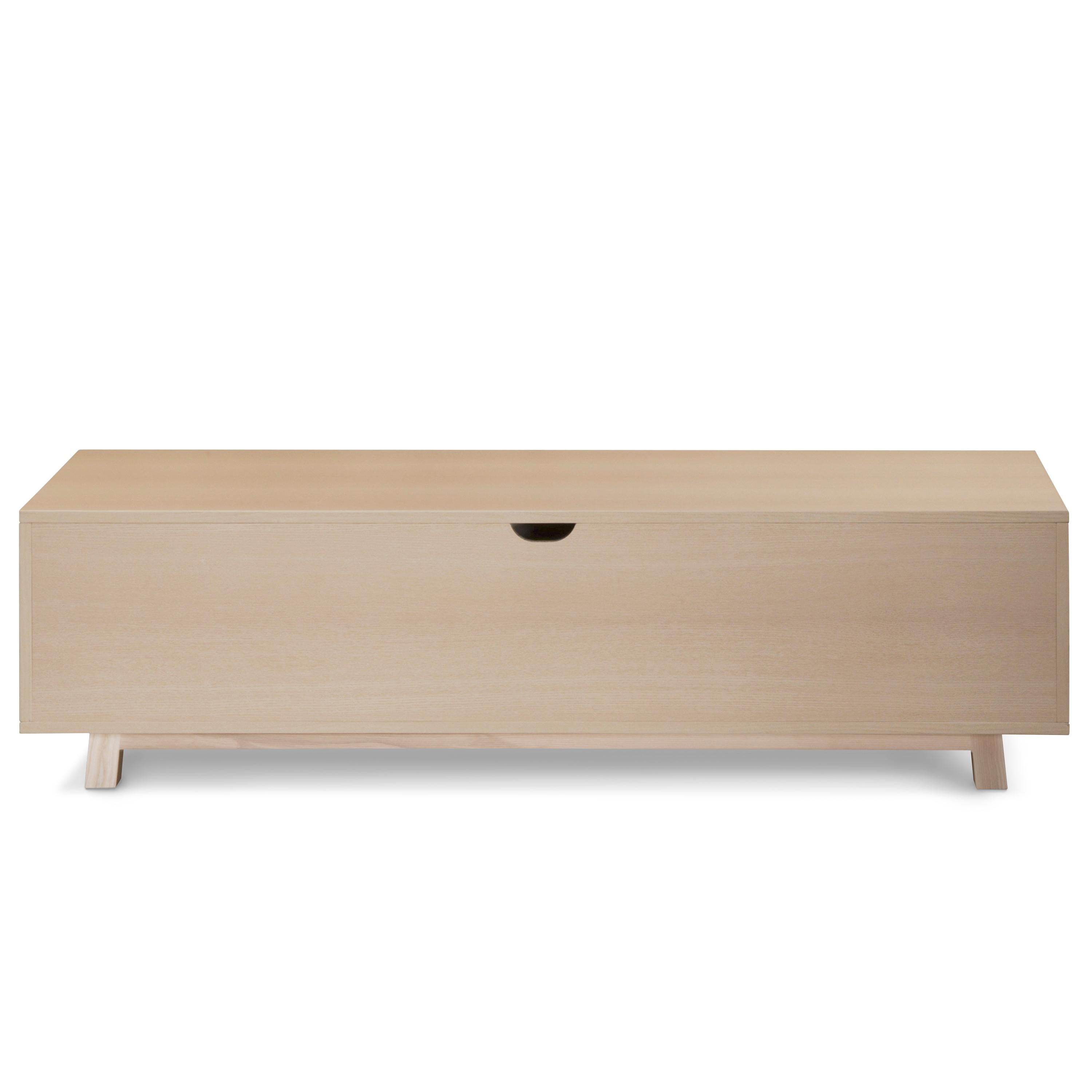 This TV stand with 2 sliding doors is designed by Eric Gizard - Paris.

It is 100% made in France with solid and veneer ash and lacquered MDF doors. 

To pull the door, use the round eyelet. 
2 adjustable wooden shelves on cleats are placed behind