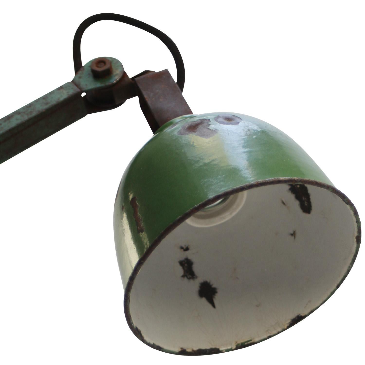 1950s Green enamel, cast iron industrial 4 arm machinist work light by DUGDILLS, UK
adjustable in height and angle
including plug and switch
width as pictures: 90 cm

Minimum length 35 cm / Maximum length 95 cm

Wall base size 19 × 6.5 cm

Priced