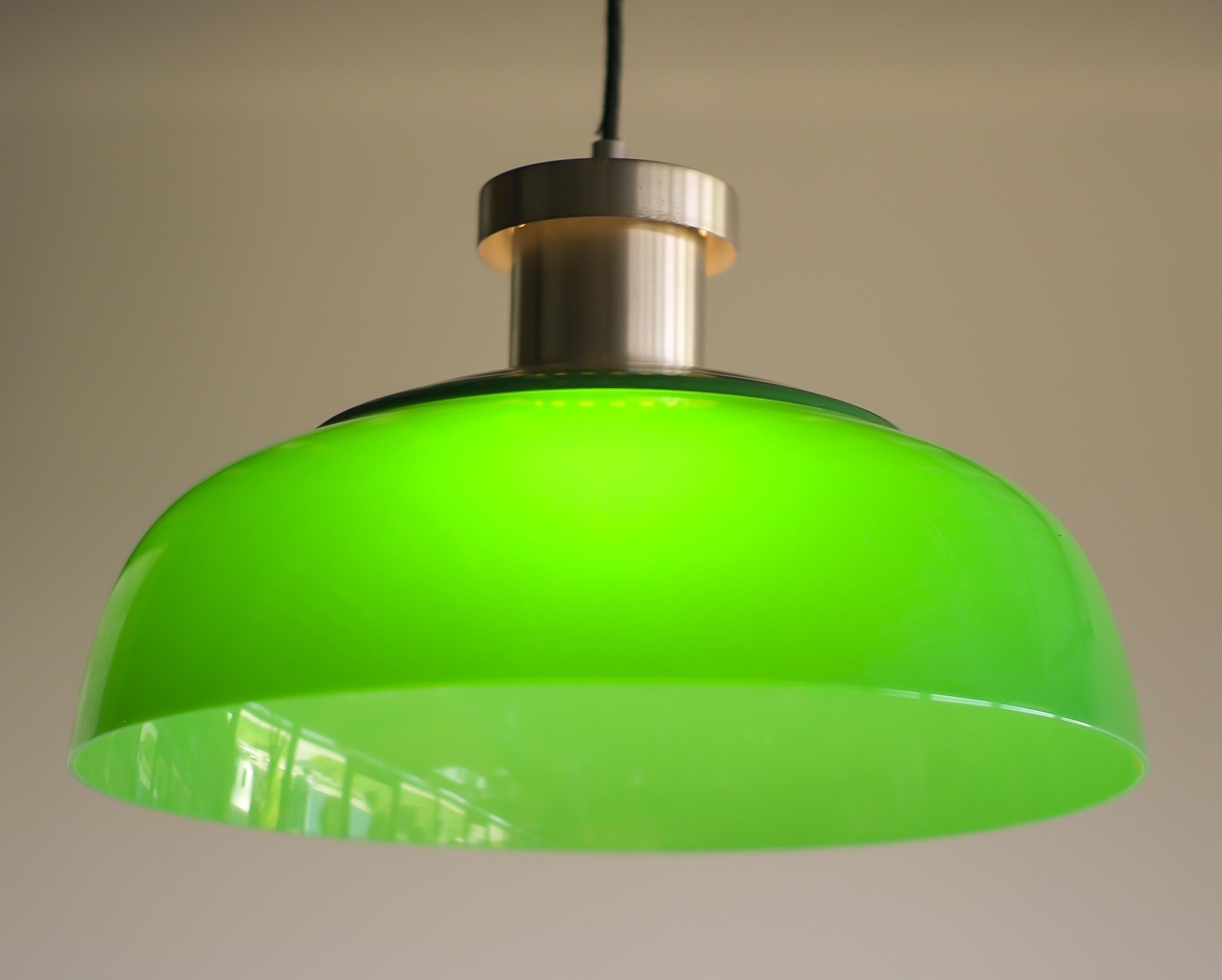 Very rare Mid-Century Modern Italian pendant. This was the first lighting design by Achille Castiglioni, manufactured by Kartell. Made of nickel-plated steel with an acrylic shade it looks very contemporary, but it is vintage Mid-Century