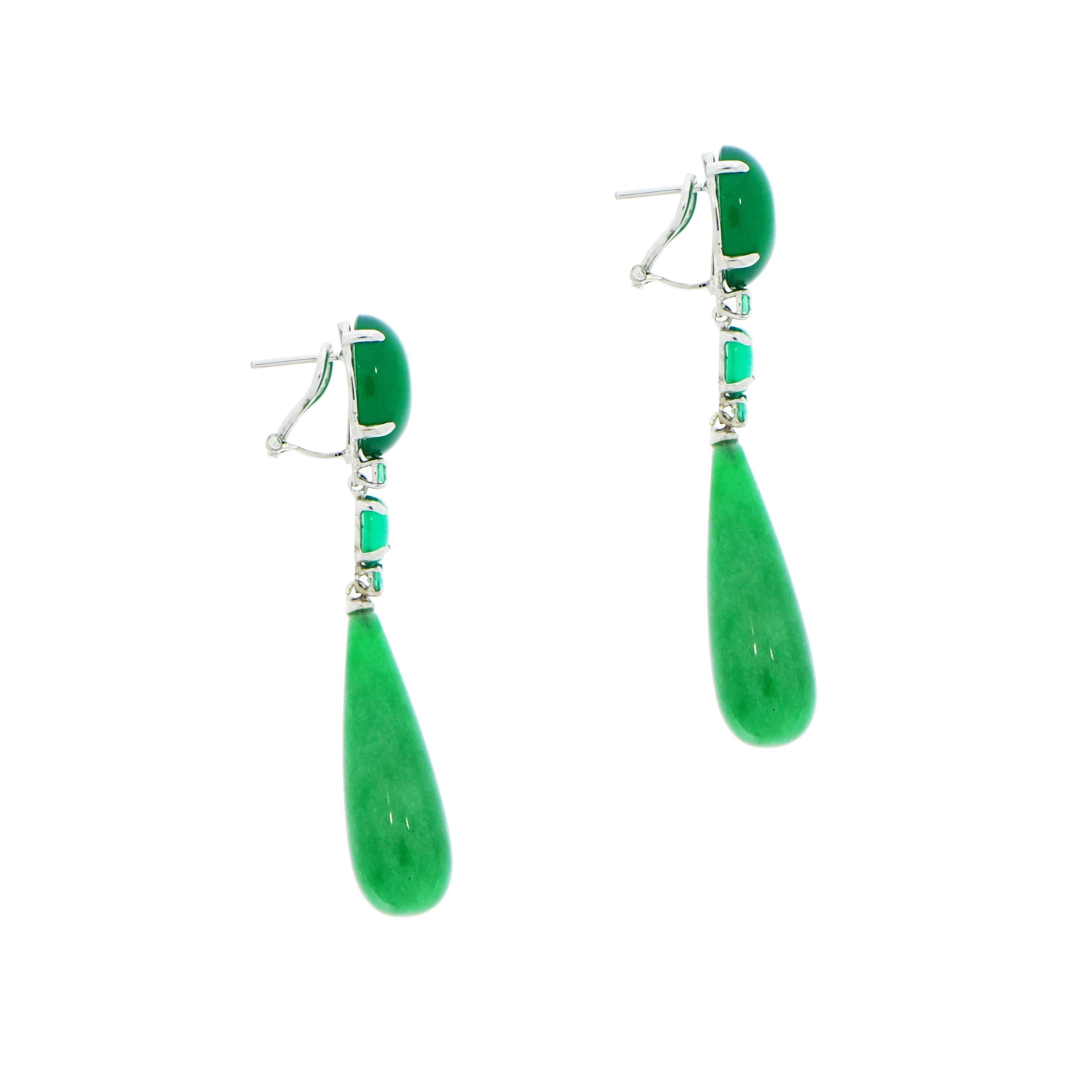 Be lucky... be green... be beautiful!!
Get this pair of gorgeous Green Agate and Emerald drop earrings held by a post, secured by an omega clasp. The oval cabochon-shaped top is set in white gold and accented with 2 small round cut emeralds, 4 in