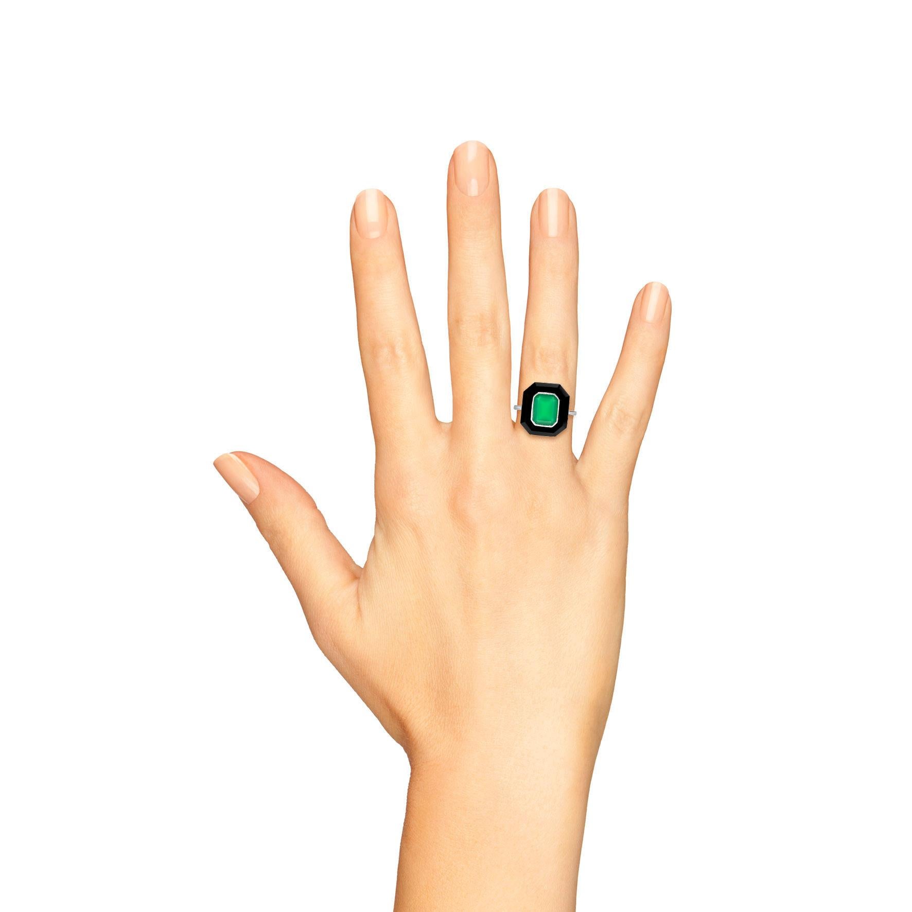 A true statement piece that encapsulates elegance and boldness. This exquisite ring features a vibrant green agate center flanked by lustrous onyx, all beautifully set in high-quality 9K white gold. The hexagon shape adds a unique flair, making it