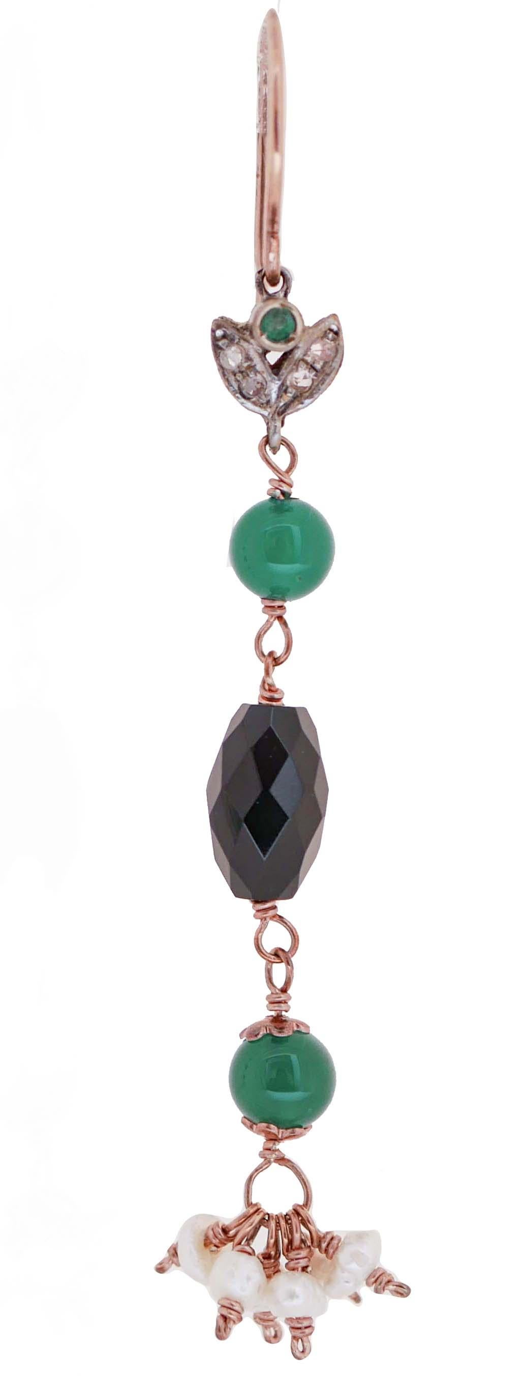 Dangle earrings in 9 kt rose gold and silver structure  mounted with leaves studded with diamonds and emerald and, below, green agate, onyx and pearls.
These earrings were totally handmade by Italian master goldsmiths and they are in perfect
