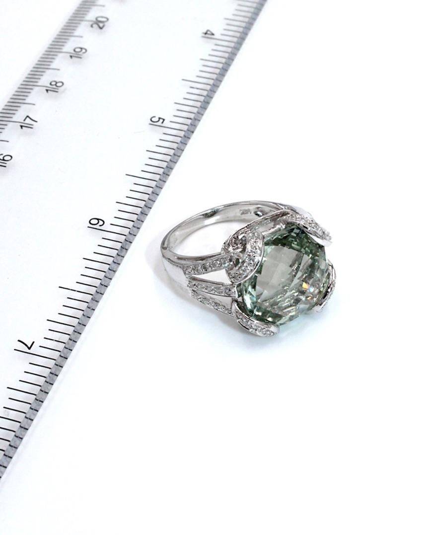 14k white gold right hand ring with one checkerboard cut green amethyst totaling 10.45 carats and 80 round full cut diamonds totaling 0.36 carats.

* Finger size: 6.75
* Diamonds are G/H color, SI1 clarity.