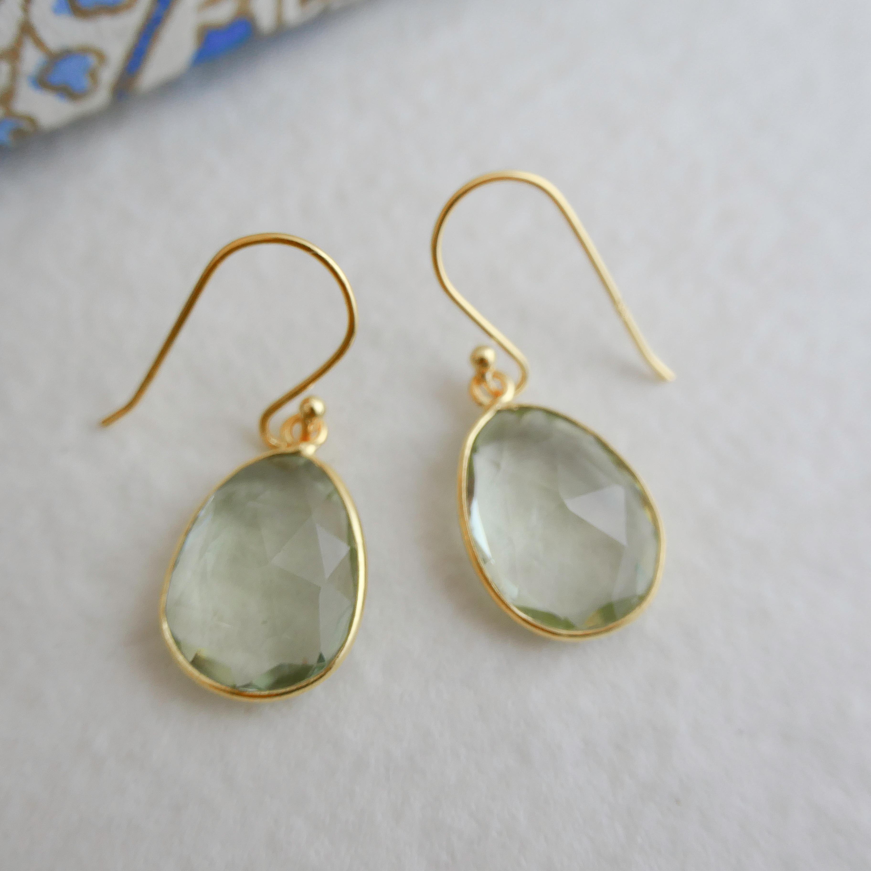 11x15mm faceted free form  cut green amethyst  set in gold plated sterling silver and placed in gold plated sterling silver  earwires.

✦Gemstone: green amethyst
✦Stone Cut: faceted free form cut
✦Stone Size: Approximately 11x15mm
✦Size of earring