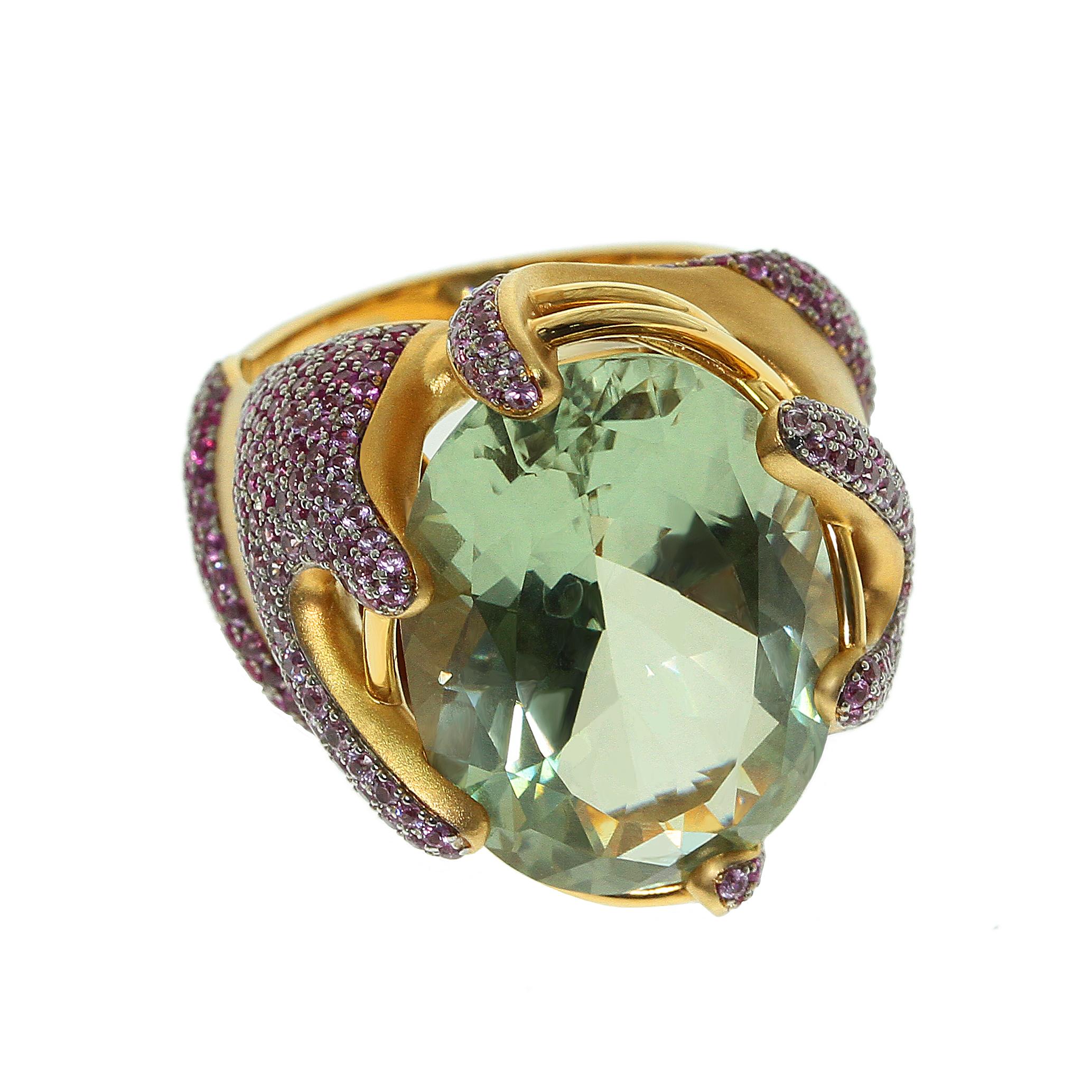 Green Amethyst Pink Sapphire 18 Karat Yellow Gold Ring
Green Amethyst weighing 16.13 carat is the center of the designer's artistic project. Yellow 18 Karat Matte Gold perfectly set off the shimmer of Pink Sapphires. Gold remind us the shape of