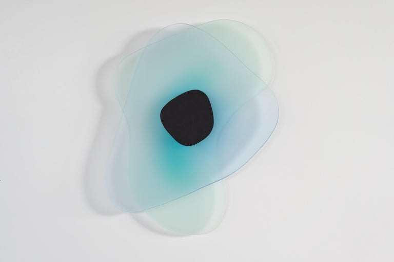 Inspired by NASA satellite footage, the Aurora sconce captures the feeling of flying through space and witnessing the southern lights from above. Available in a palette of delicate greens, fuchsias and blues, the sconce seeks to mimic the mélange of