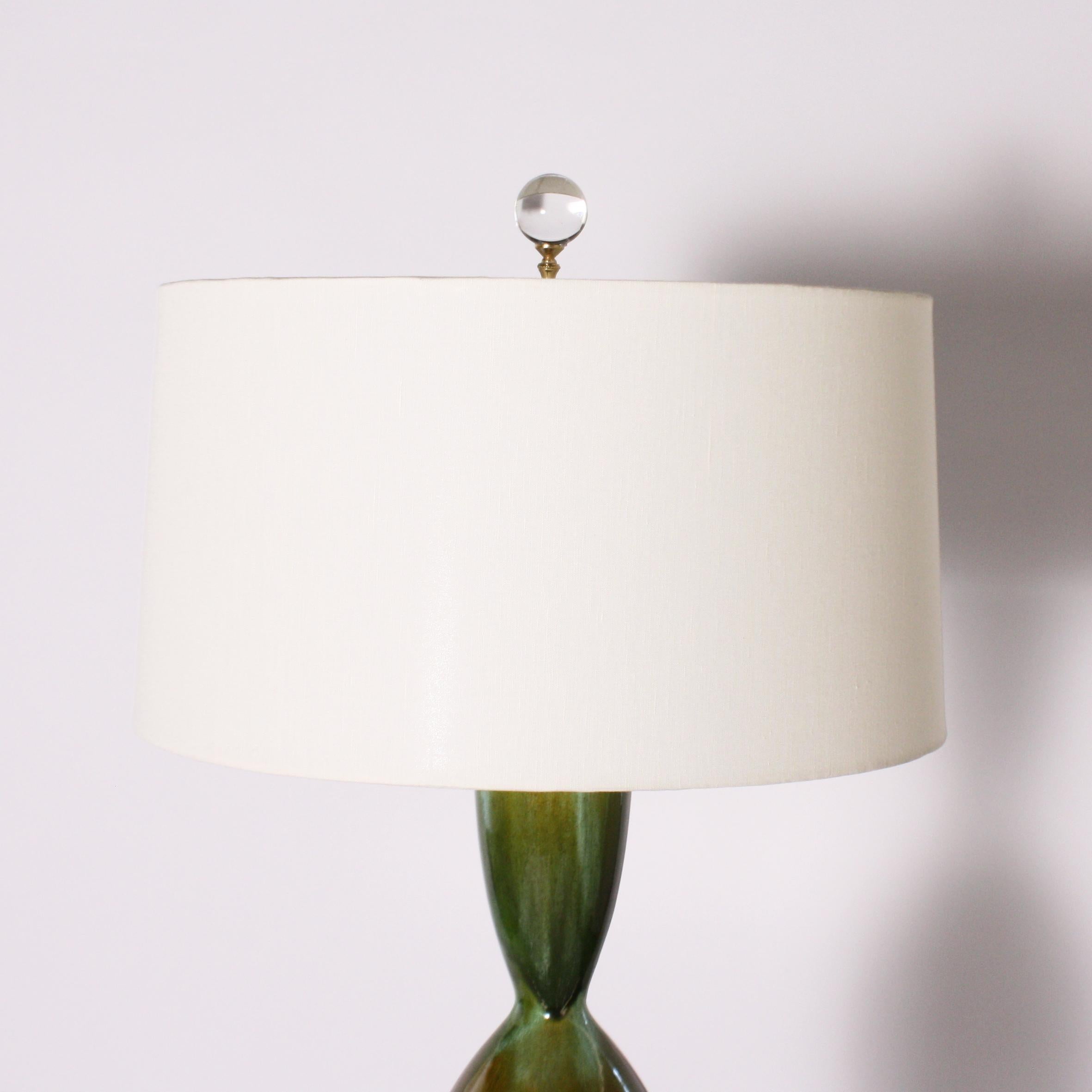 Green and blue ceramic lamp, circa 1960

Custom linen shade, crystal ball finial, Lucite base, and new gold twisted cording.
