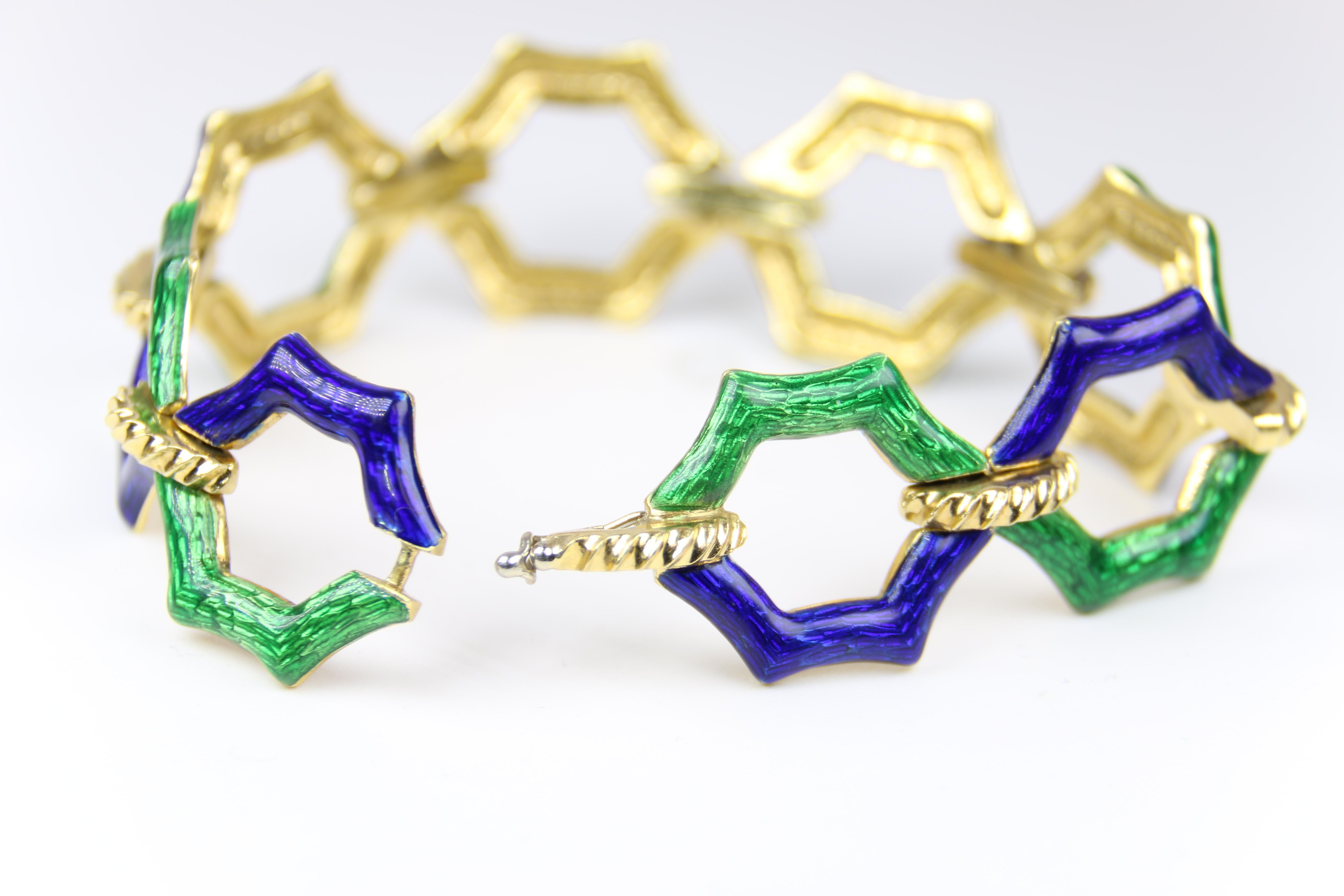 This is an 18K Yellow Gold Blue and Green Enamel Bracelet, with a unique design. Fitted with a safety clasp this beautiful enamel and gold piece is truly stunning for the season!