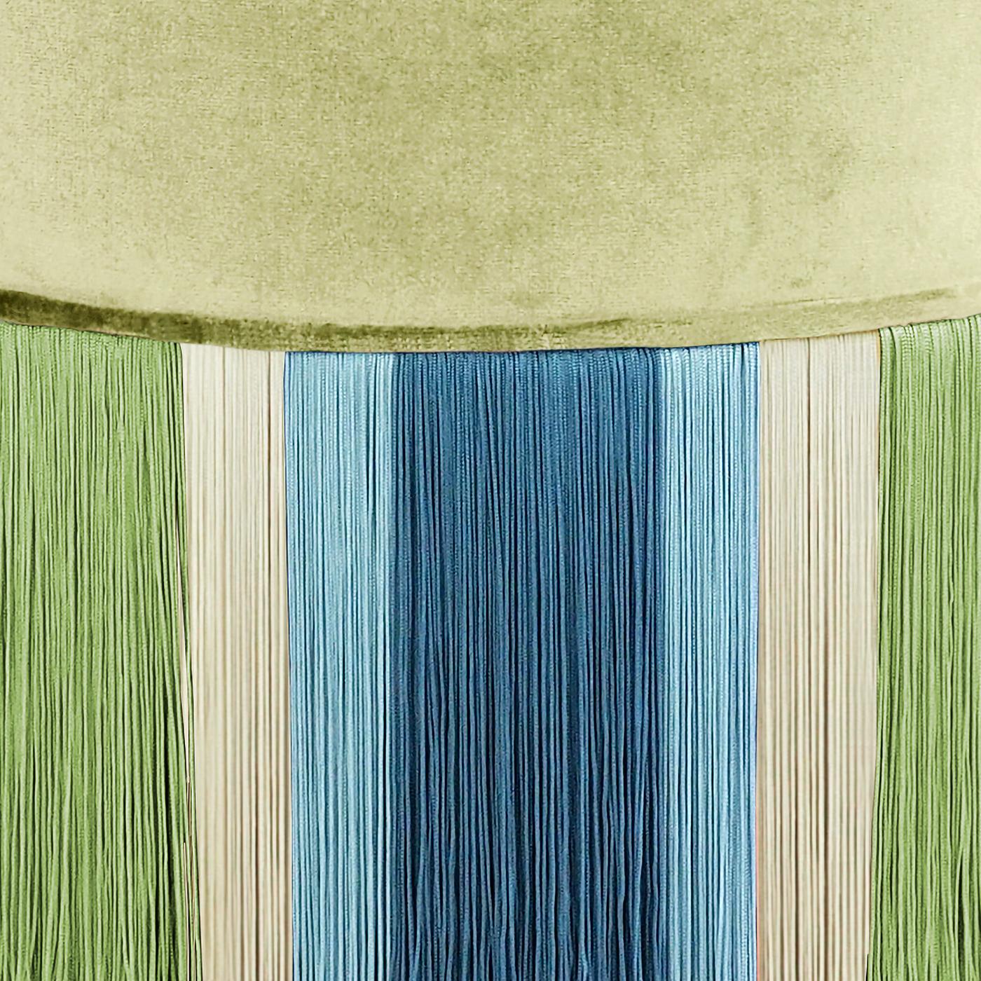 In charming peacock tones, this pouf comes from the Geometric Couture Collection, full of fun and flirty designs. On a beechwood base, the pouf is padded and upholstered in velvet then accented with viscose fringe in shades of green and blue over