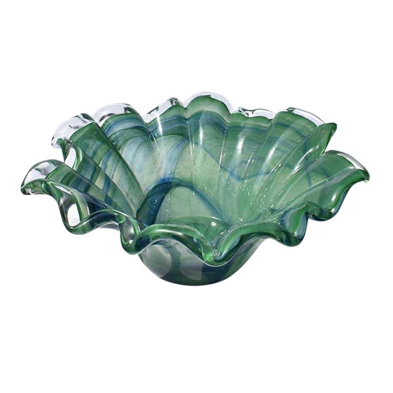 Beautiful green and blue Murano glass bowl or vessel. The sides have lovely scallops that curve around the entire perimeter of the piece. Throughout, the blue and green look almost like a marbled watercolor of greens and blues dotted with faint