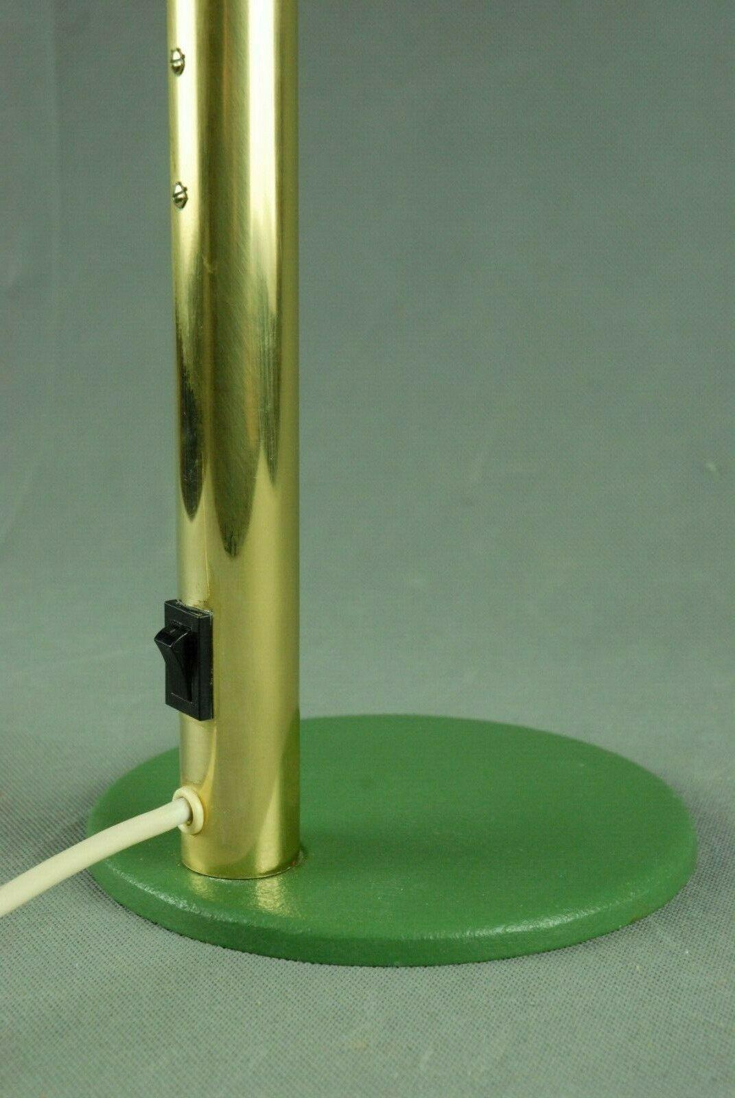 An unusual 1960s green desk lamp with brass adjustable stem and domed shade. Manufactured by Kaiser Leuchten, Germany.

Currently wired for the UK.
