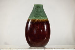 Green and Brown Glazed Ceramic Vase with Drip Effect and Rounded Silhouette