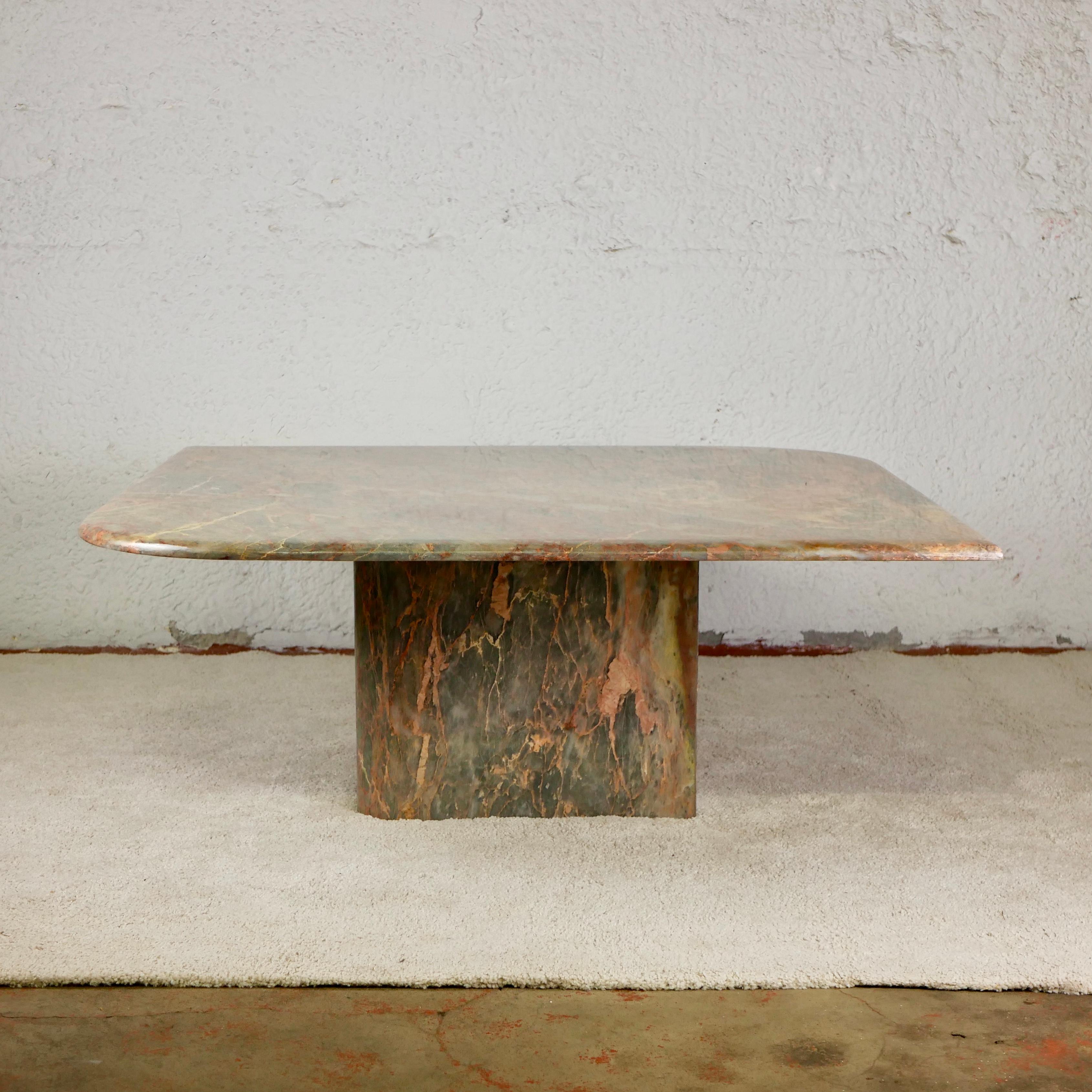 Stunning and large marble coffee table, made in Italy in the 1970s. Beautiful and rare green and coral fading. 
Base and top have the same shape : a square with 2 opposite rounded corners.
Also a metamorphic table with eye-shape when arranged