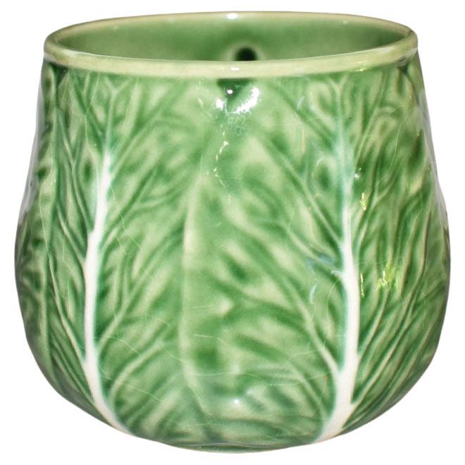 A pretty green and cream cabbage ware or lettuce ware coffee mug. 

Dimensions:
5