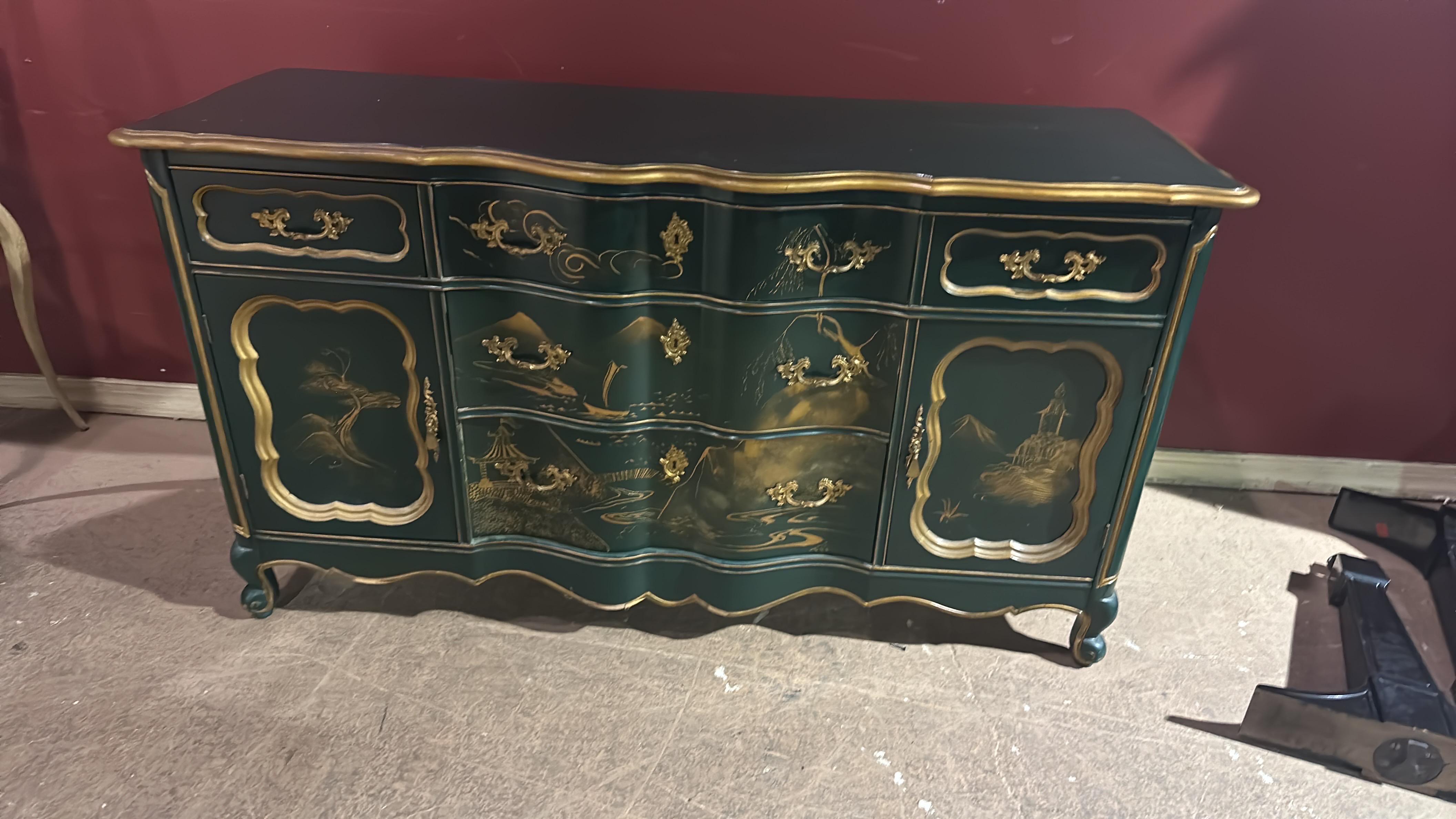 This is a stunning green and gold lacquer custom-finished Chinoiserie designed sideboard or buffet. This piece was created for a wealthy customer in West Chester, New York. The buffet is in good original condition and has minor signs of age and use