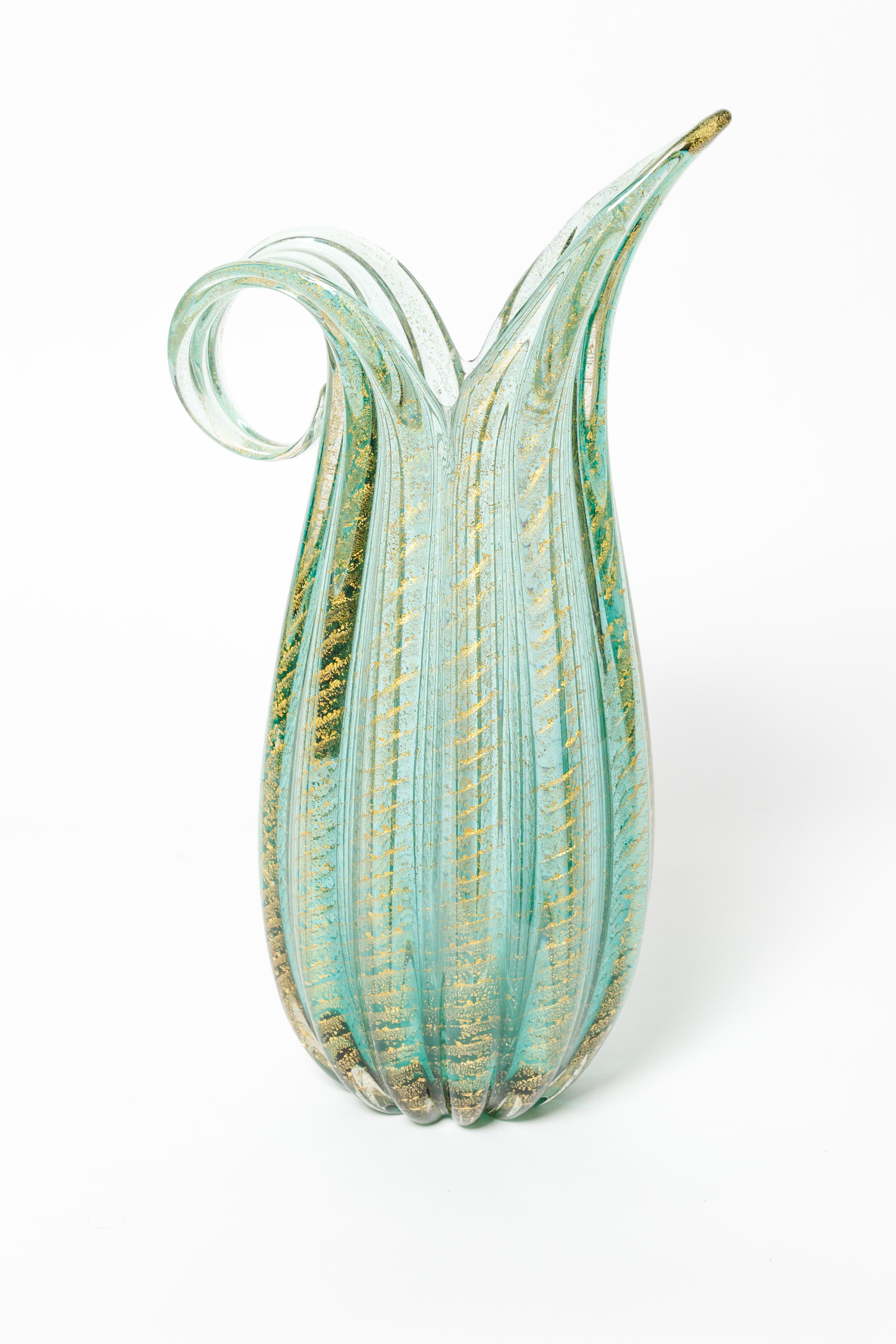 Green and gold murano glass handled pitcher with diagonal fluting.